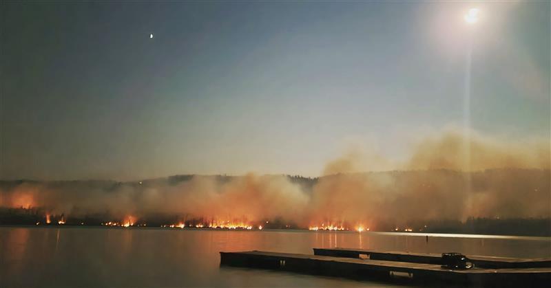 Fire along Alturas lake shore at night , 9/8