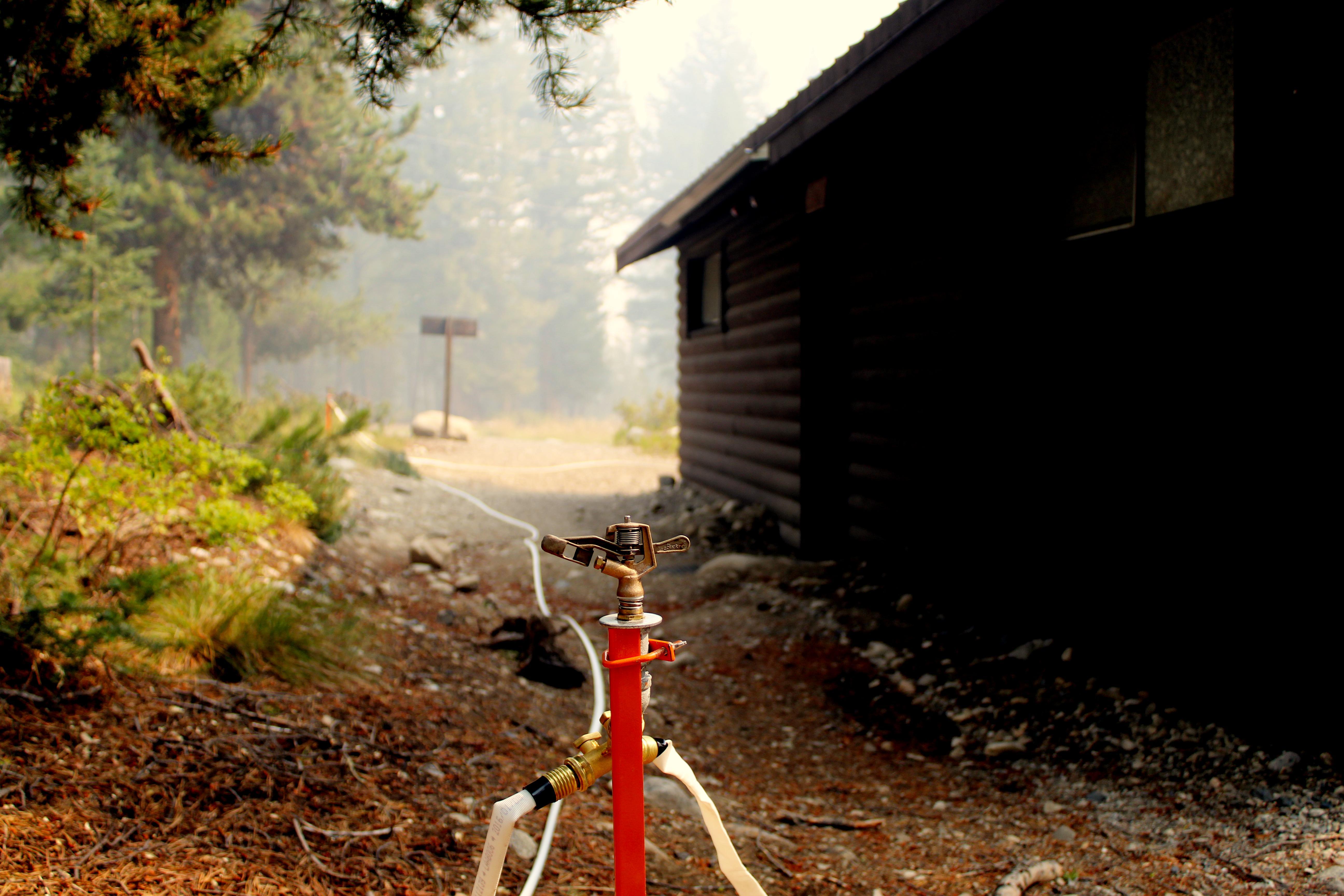 a sprinkler at cabin creek for structure protection