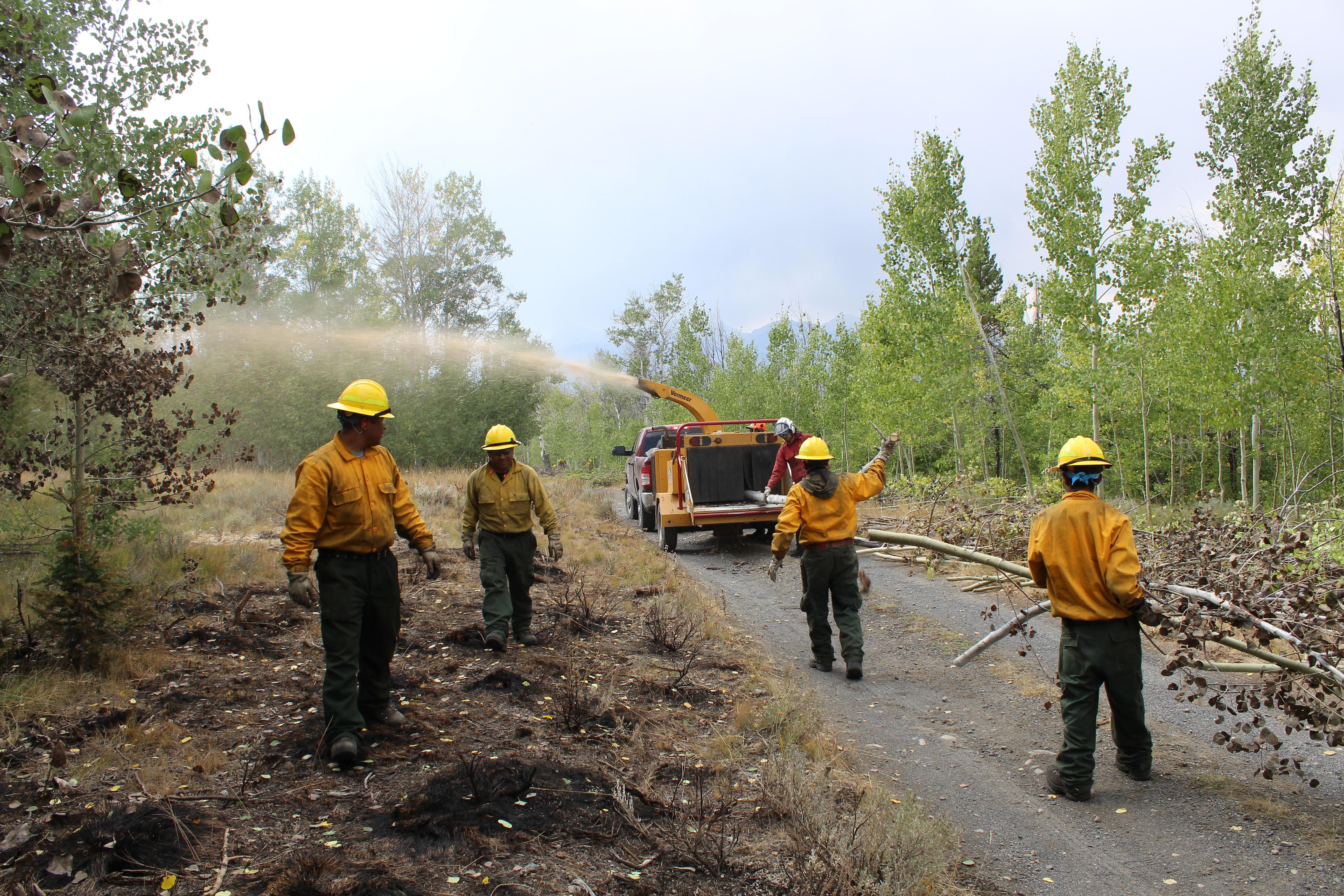 chipping crew works on east side of fire