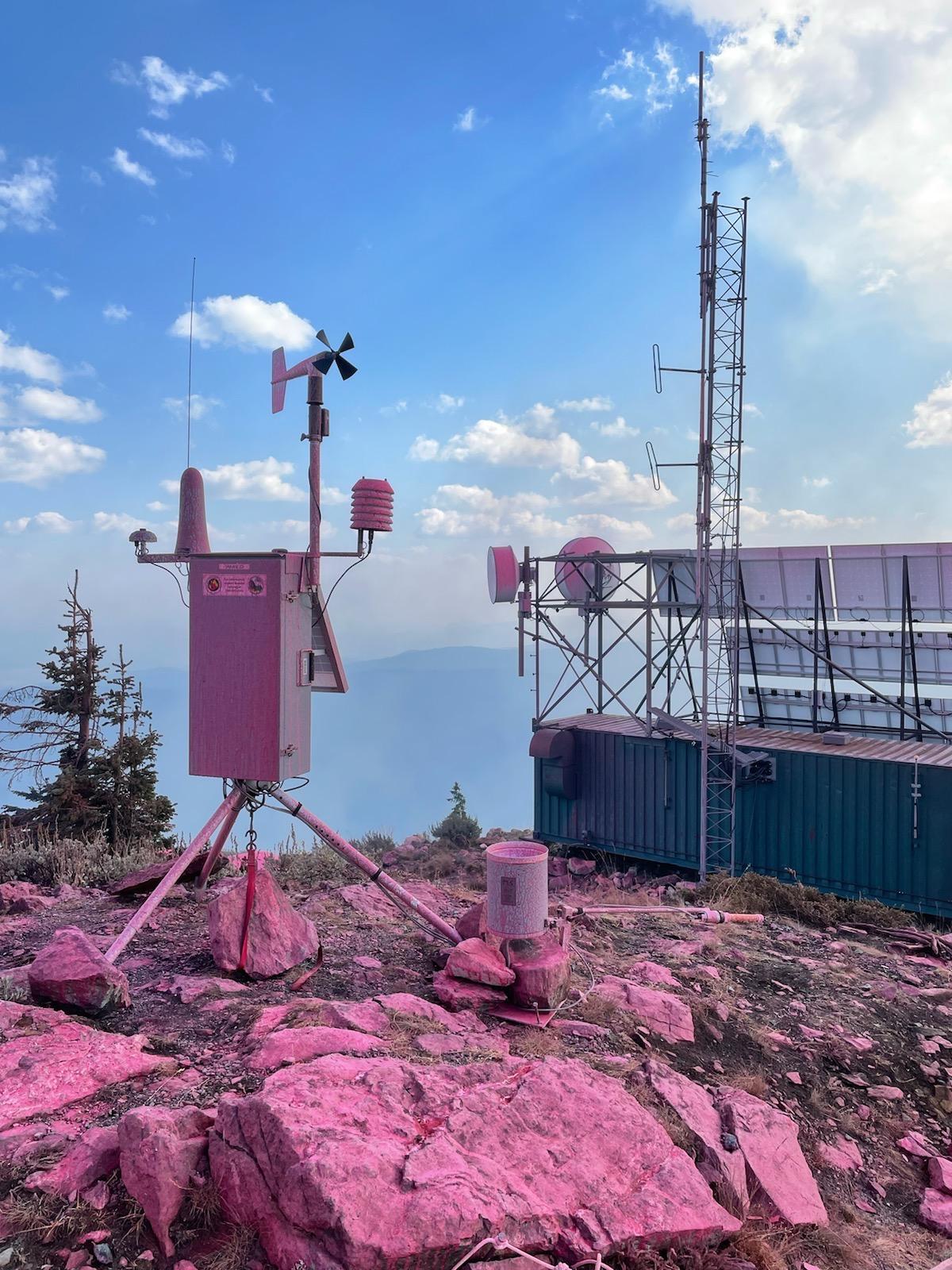 A retardant drop made Sept. 8 to protect the communications site on Calispell Peak from the Boulder Mountain Fire painted this Remote Automatic Weather Station pink.