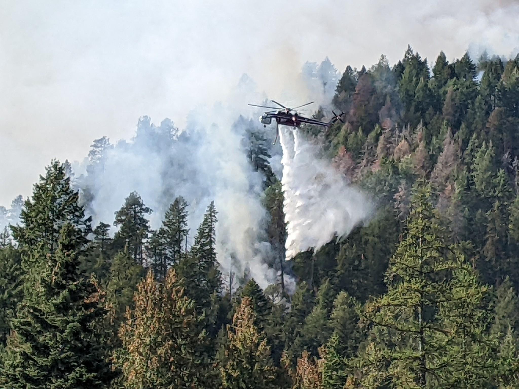 Fire officials reported some increased fire activity along Westside Road near Trout Creek Road prompting a few water drops using a heavy helicopter to knock down the fire's intensity