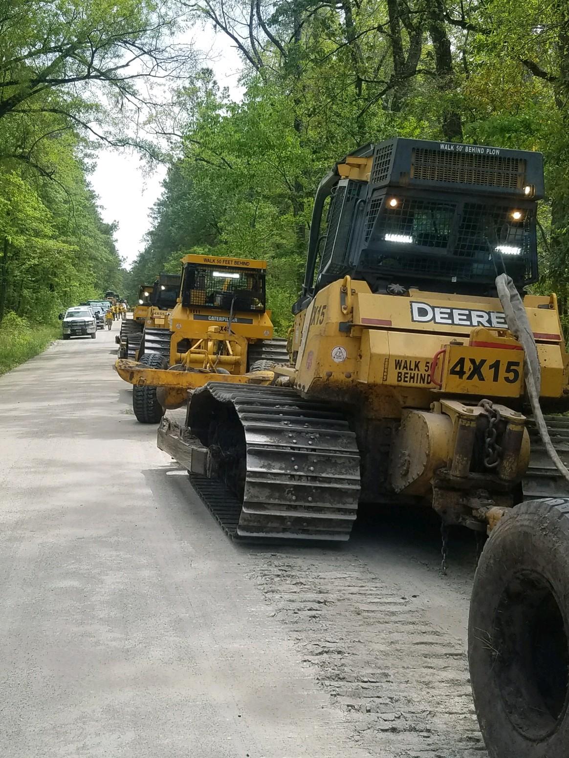 Dozers line up before entering the fire area on the Great Lakes Fire, April 24, 2023