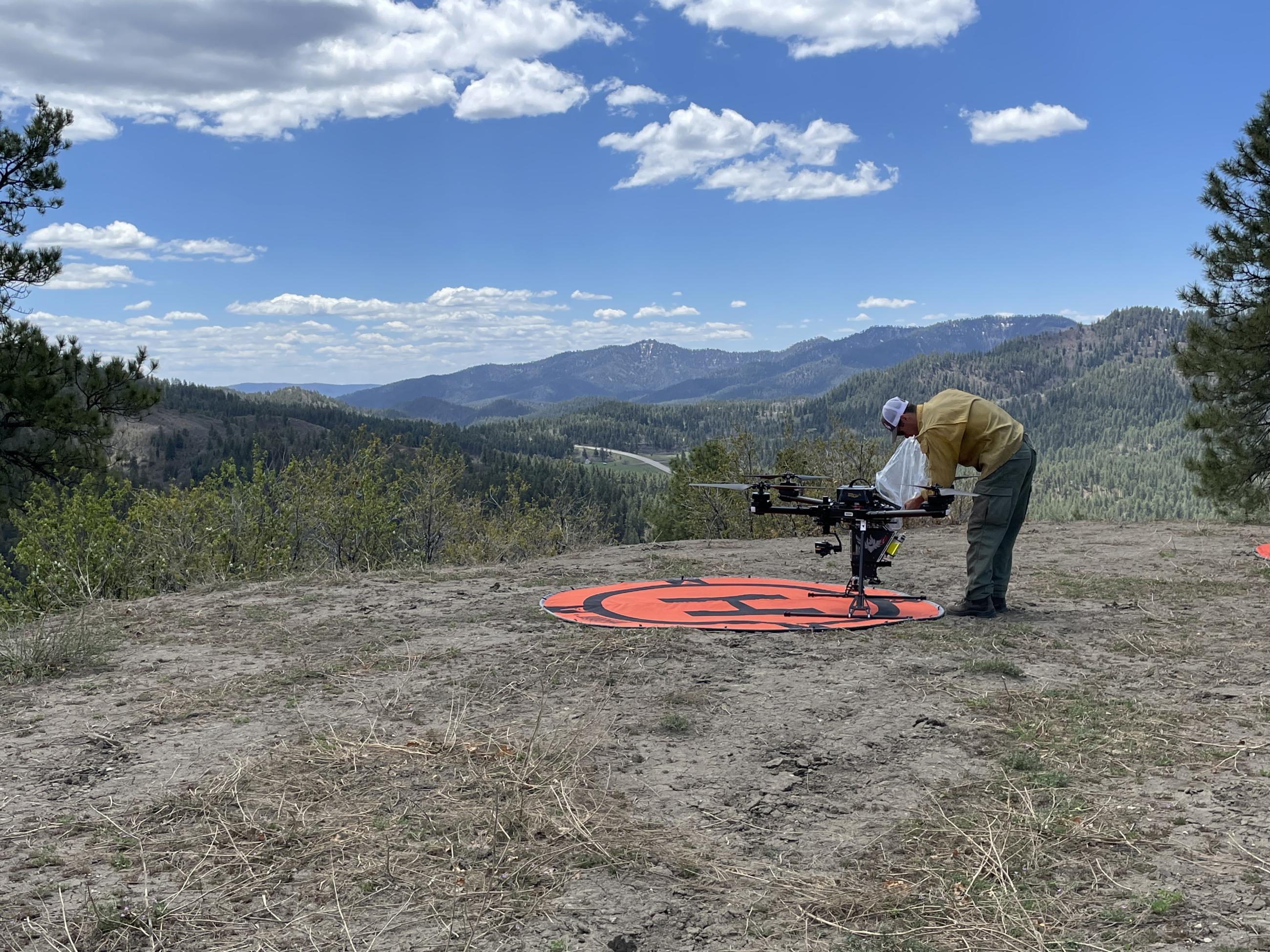 A drone pilot prepares equipment