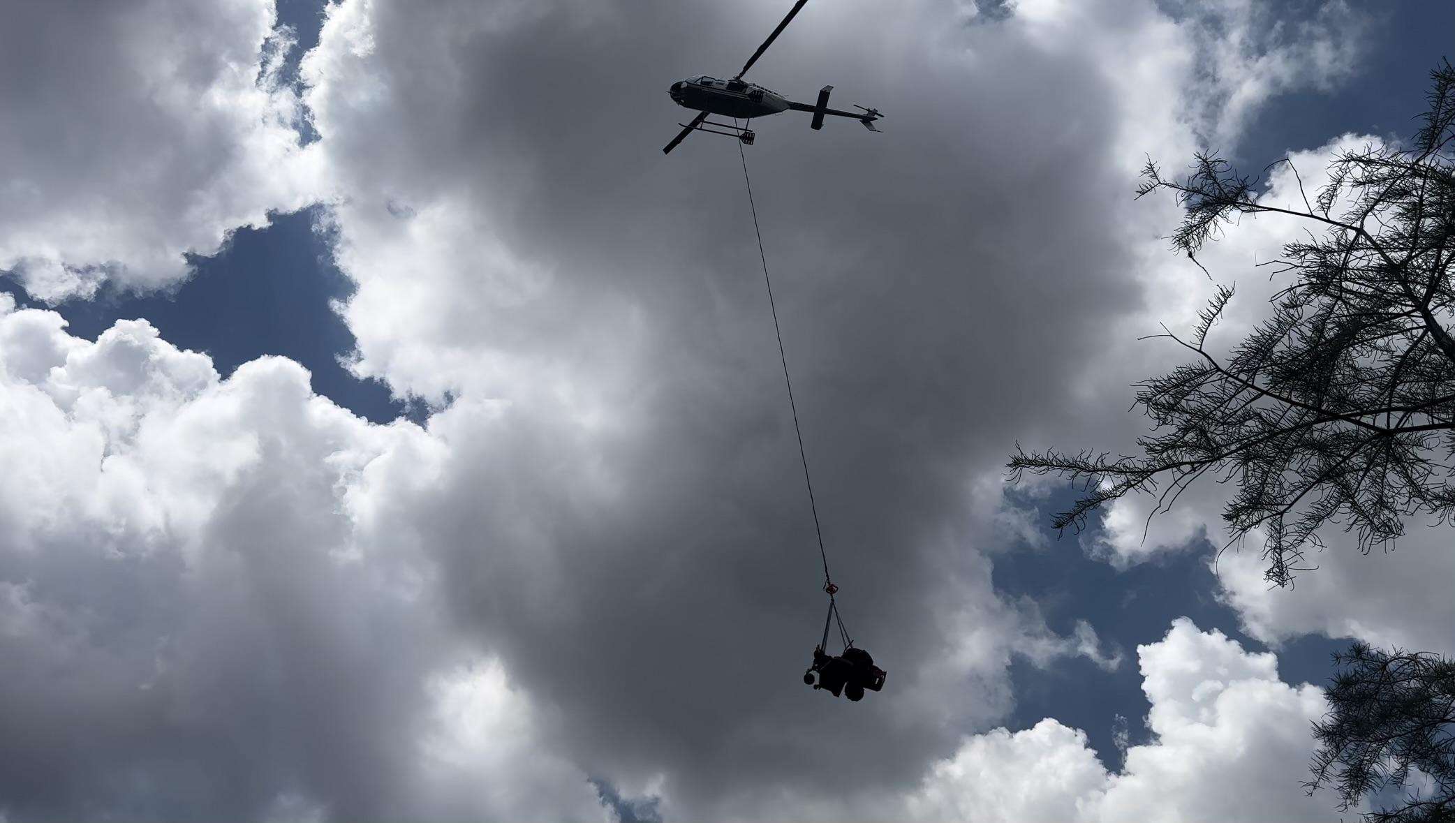 Helicopter Sling Loads Lawnmower for Structure Protection