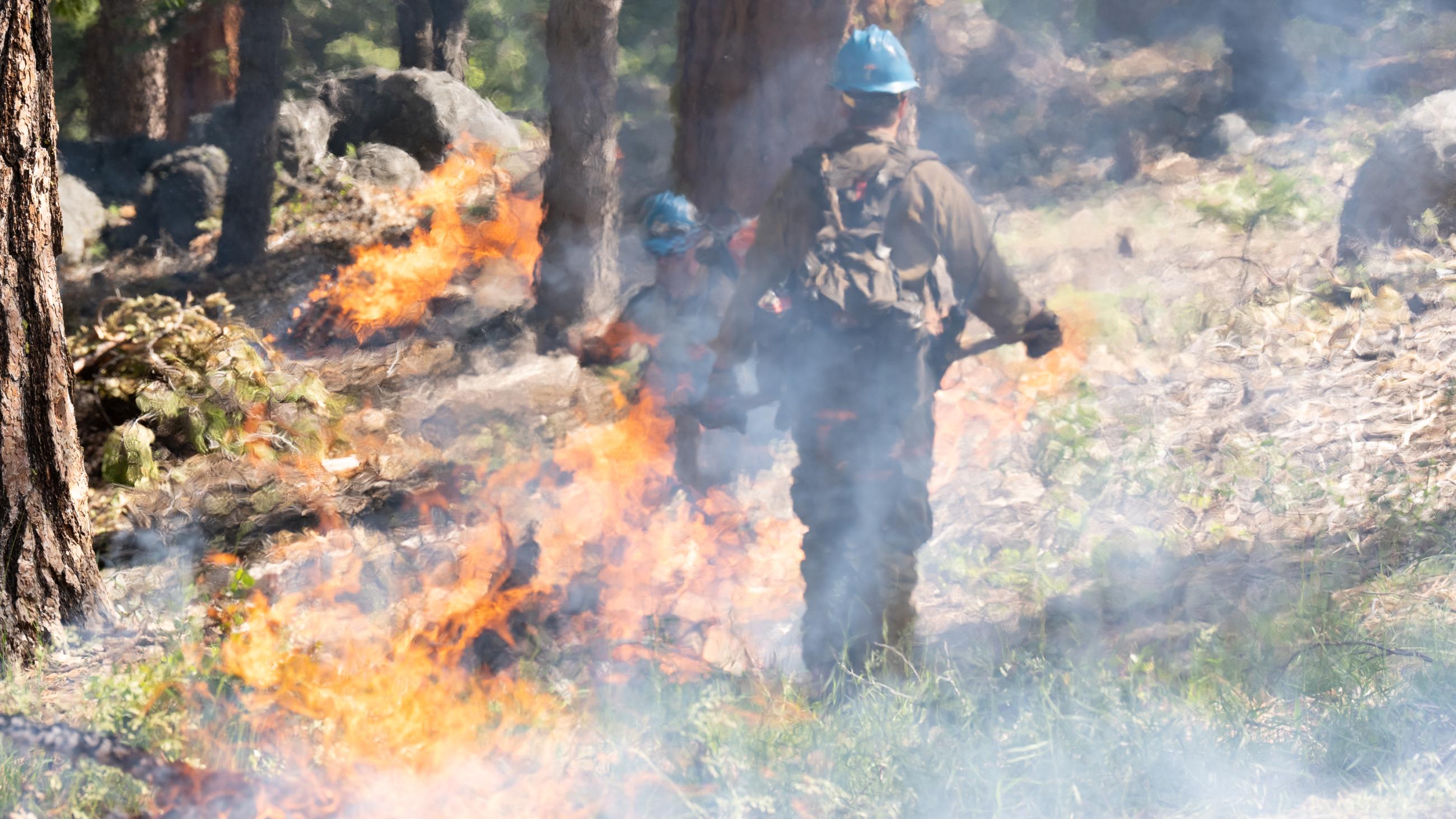 Firefighters keeping a close eye on actively burning brush pile 