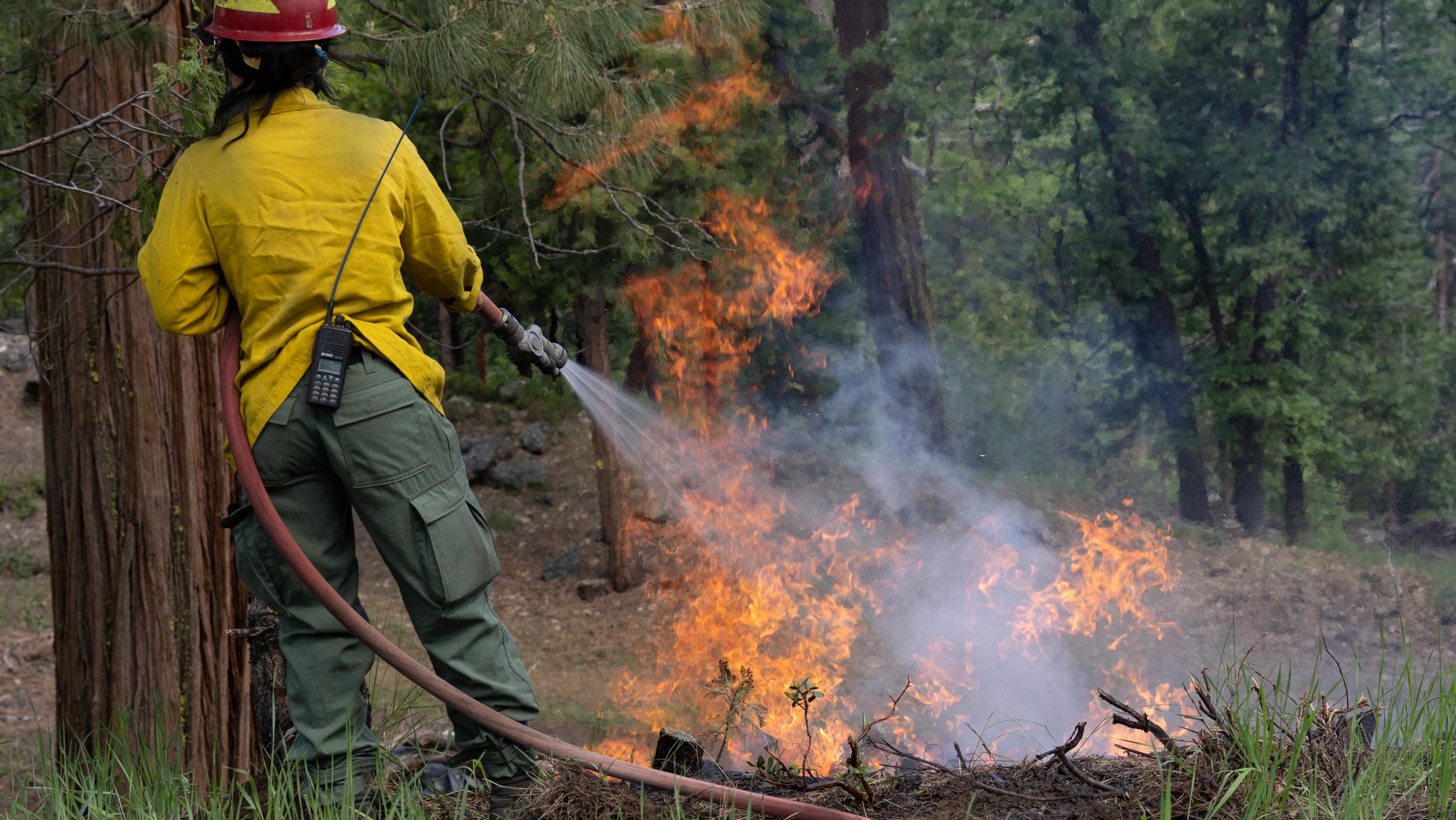 Cooling down a burn pile with water 