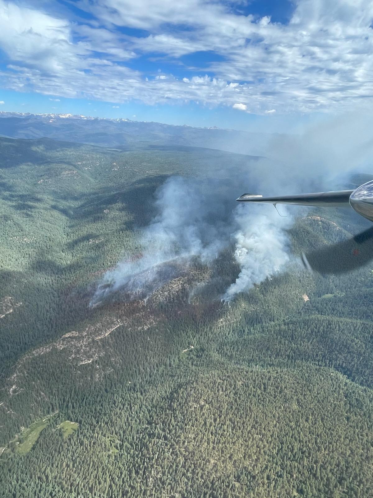 Aerial photo of fire with white smoke