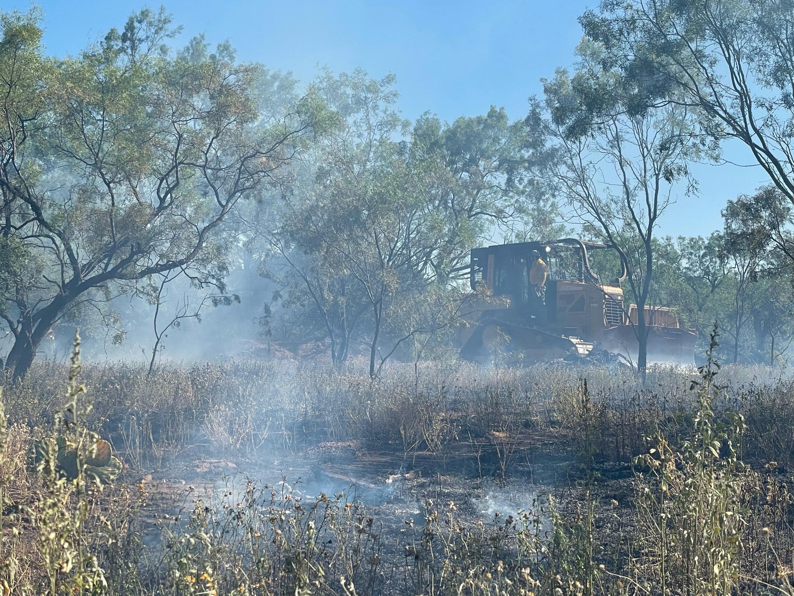 Texas A&M Forest Service dozer constructing containment line