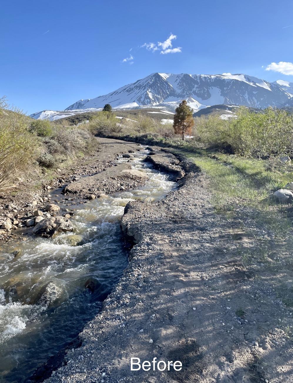 Image showing Parker Lake Road (FS 1S25) Before Repairs having a large open trench/gully running down the left side of the dirt road