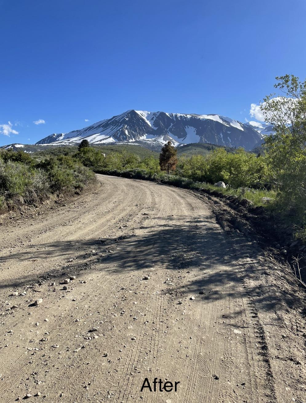 Image showing Parker Lake Road (FS 1S25) Before Repairs where the dirt road is smooth with no trench or gully running down the side of the road