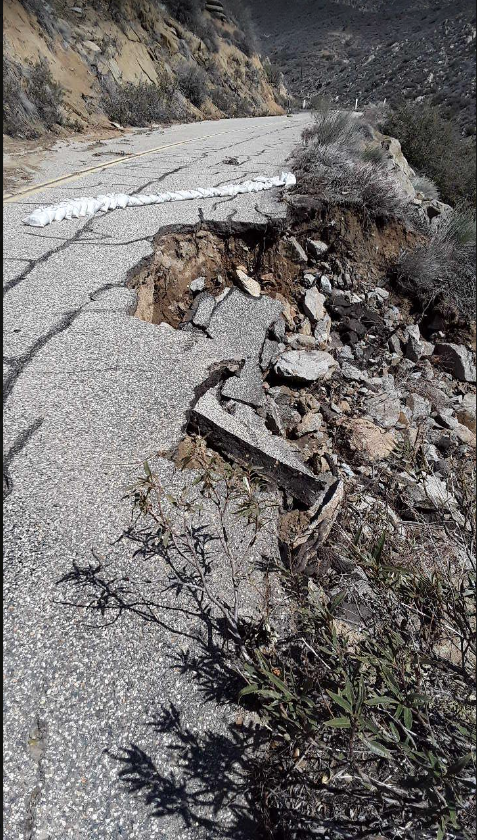 Portion of the outer travel lane erodes down the hill due to significant winter erosion. 