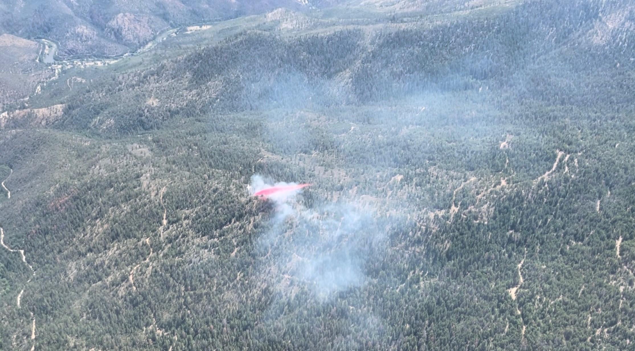 A tanker dropping retardant on the Trail Fire on June 10, 2023.