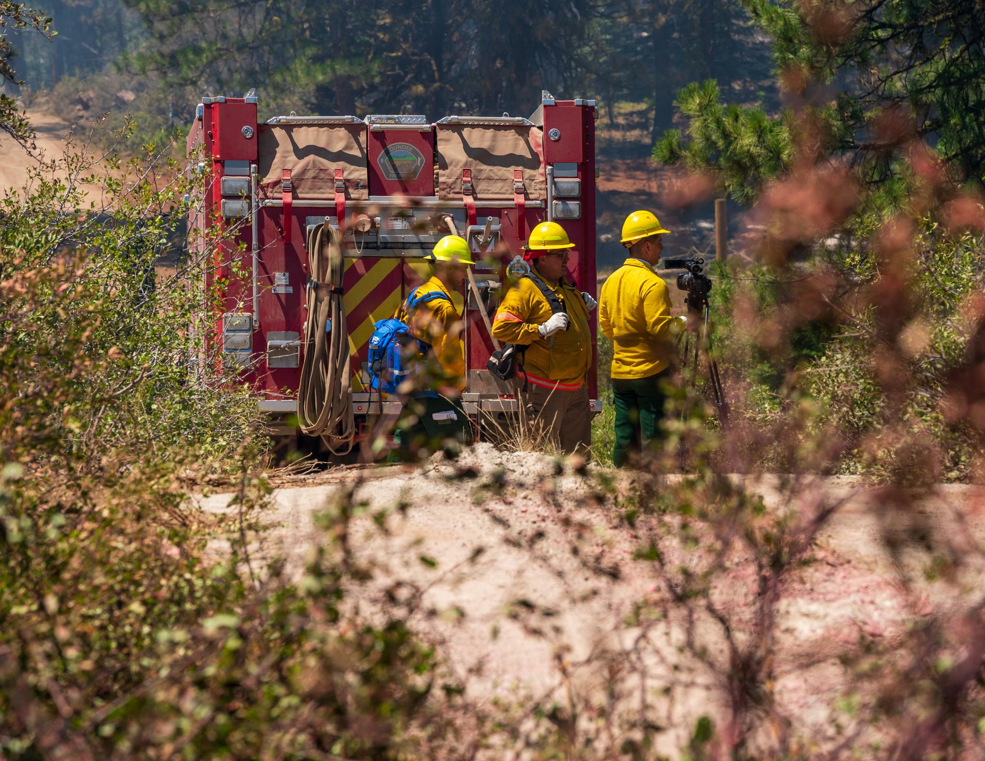 Photo of ODF IMT-2 PIO trainee Bryan Longoria escorting media on the fireline of the Golden Fire in Bonanza, Oregon.