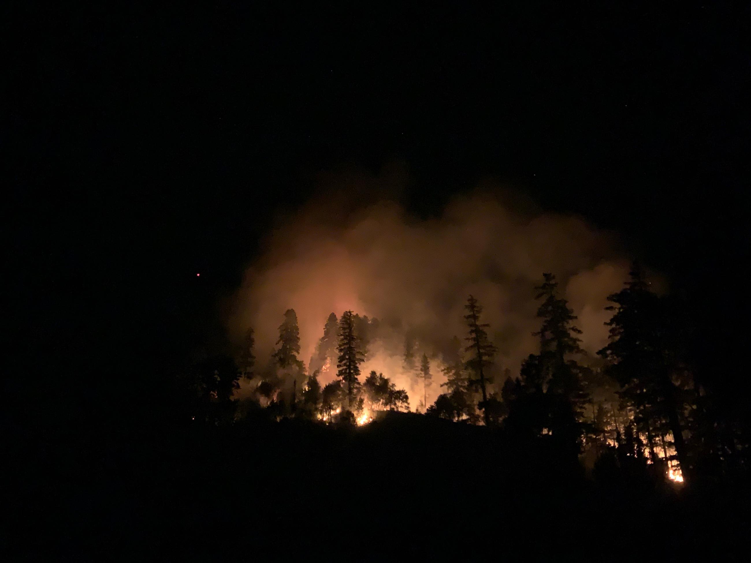 Glowing fire at night from the Illinois River area on the Rogue River - Siskiyou National Forest 