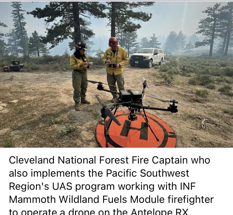 Image showing the Cleveland NF Fire Captain working with Inyo NF Mammoth Wildland Fuels Module firefighter to operate a drone on the Antelope RX