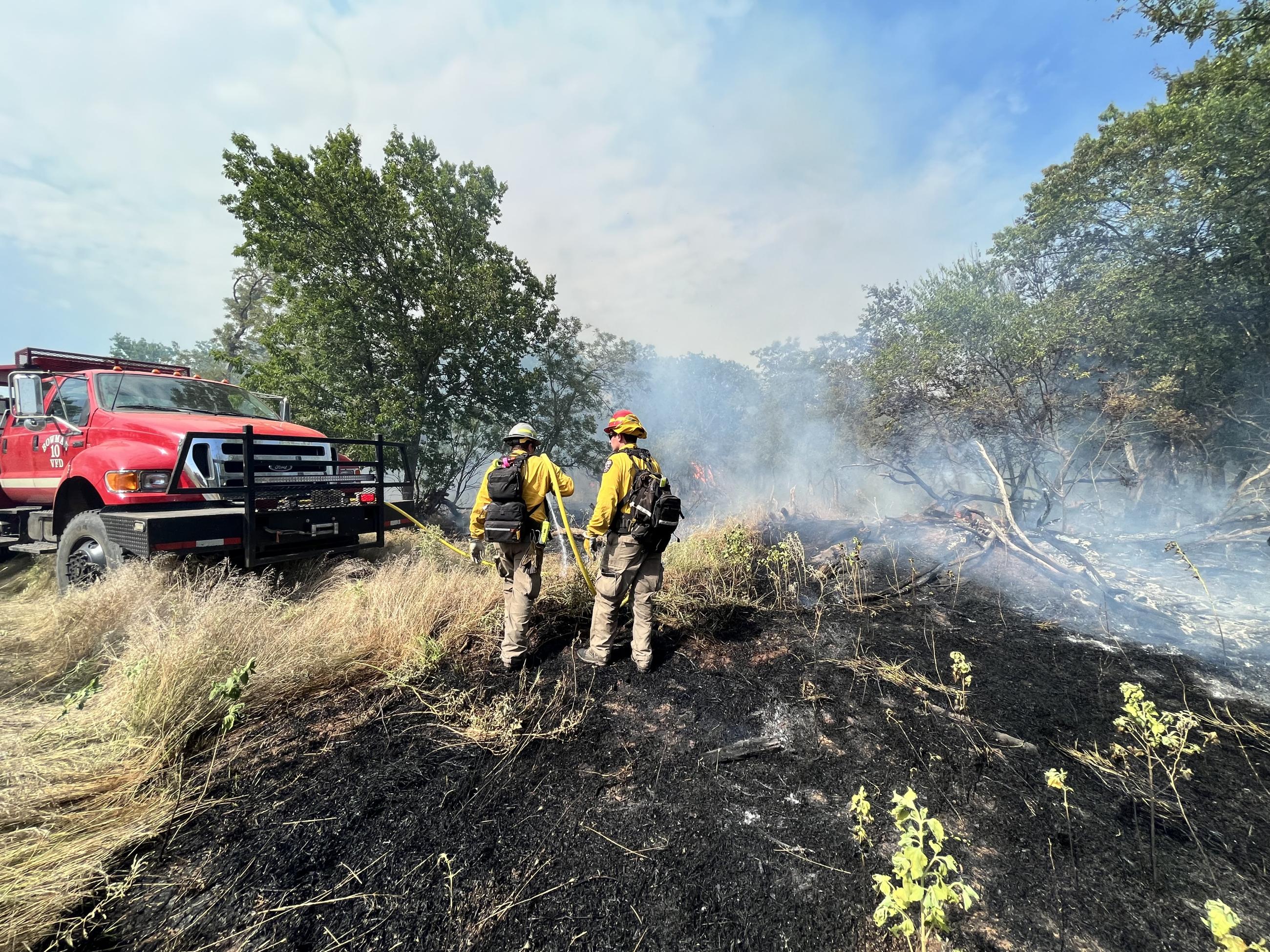 Engine Crews working along the containment line.