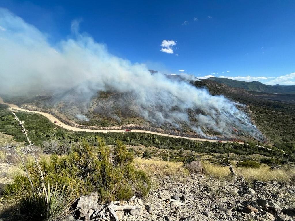 smoke and fire reaches fireline on July 7