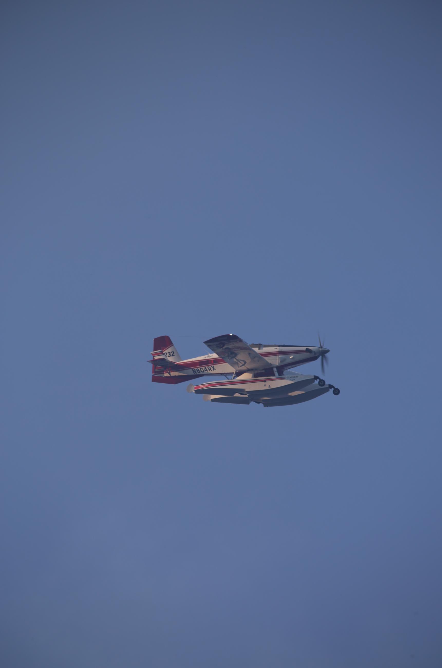 "Scooper" plane flying in support of the Tunnel Five fire. 