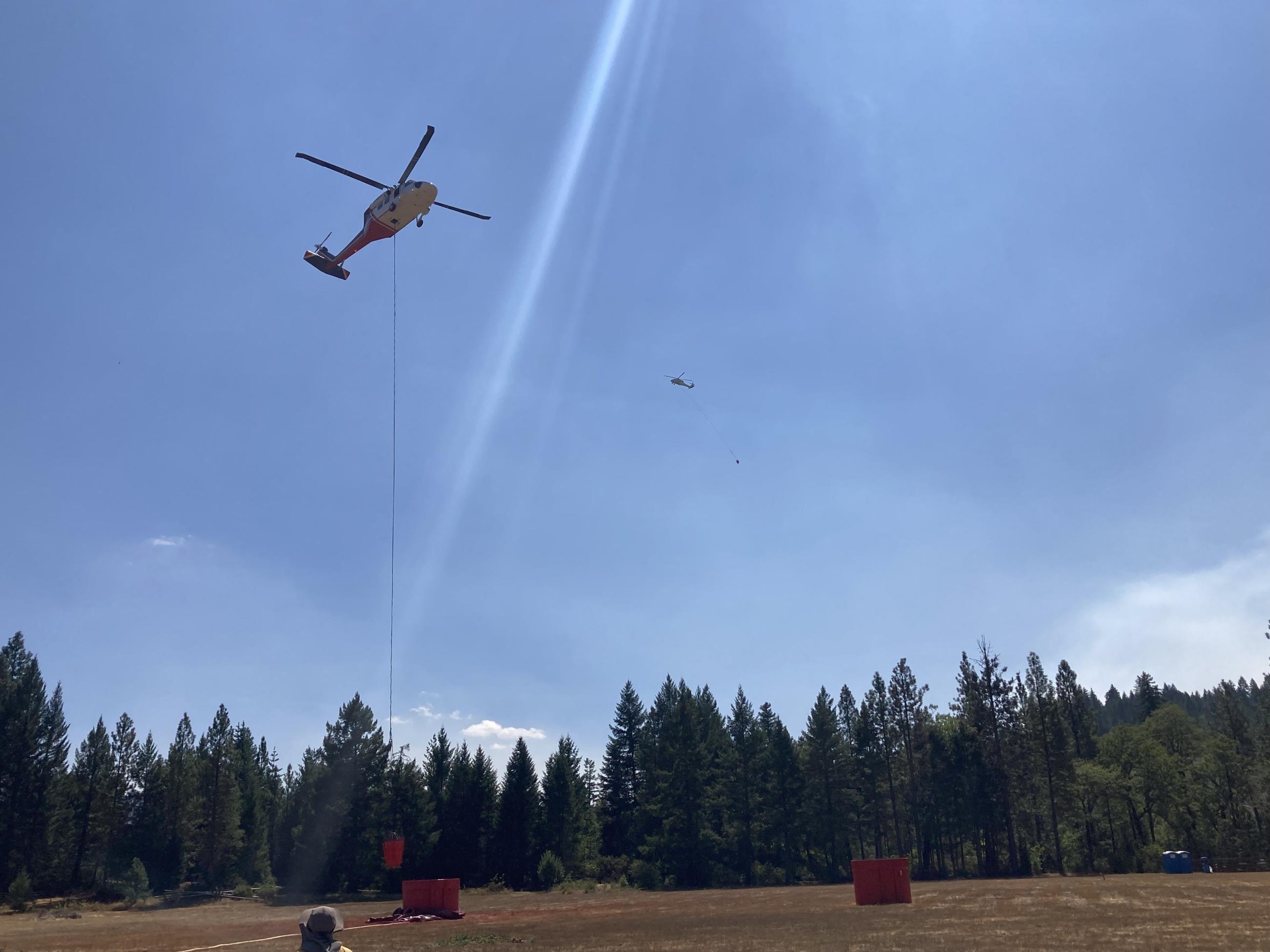 Helicopter dipping at mobile retardant base, August 29