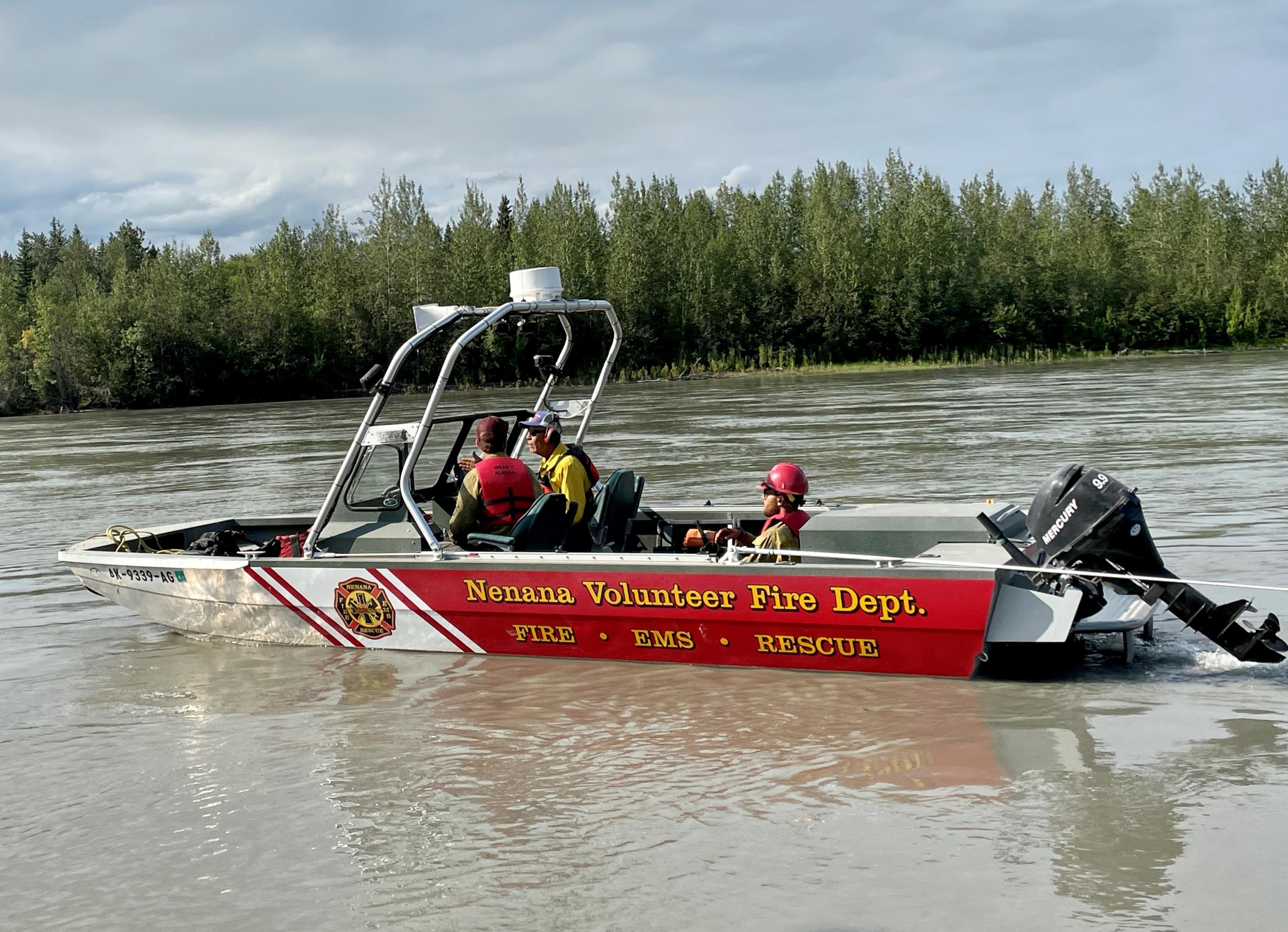 A jet boat is used to ferry firefighters from Nenana to the Teklanika Fire