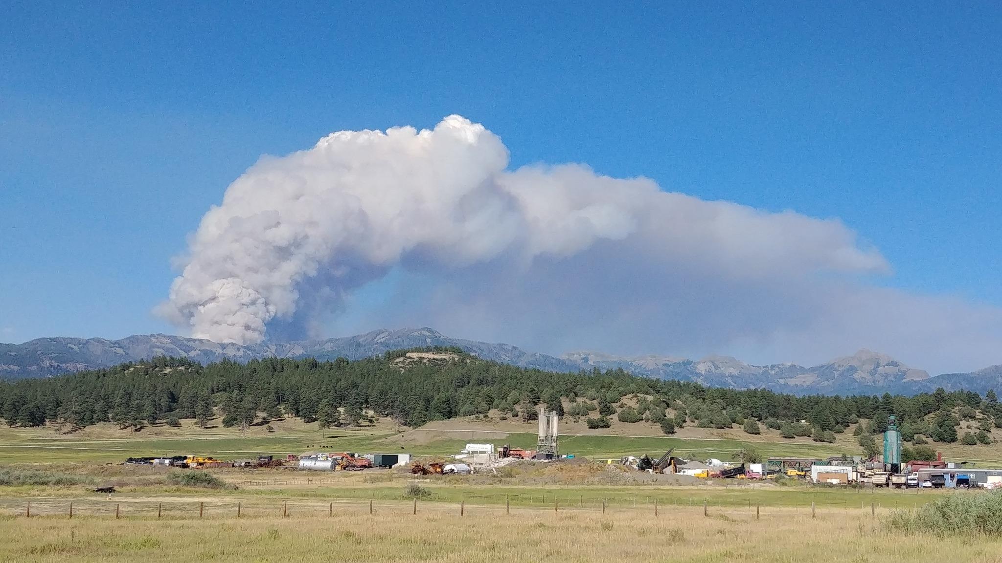 Fire column bent over from wind