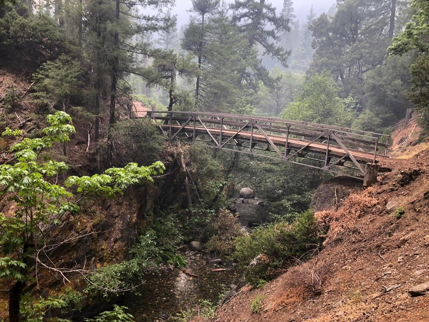 Stuart Fork Trail bridge with smoke