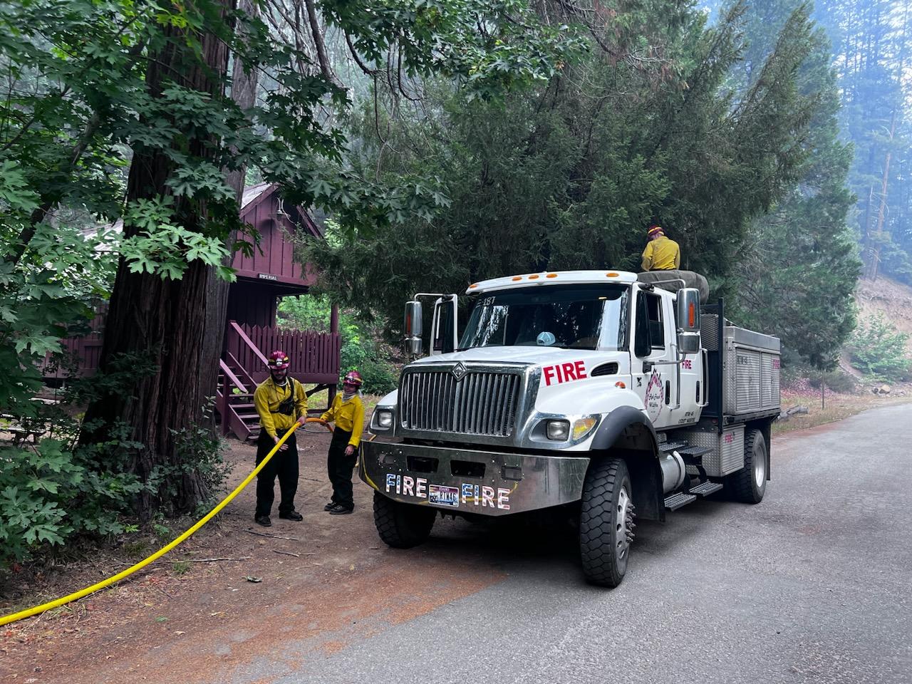 Engine crew placing structure protection equipment at Trinity Alps Resort.