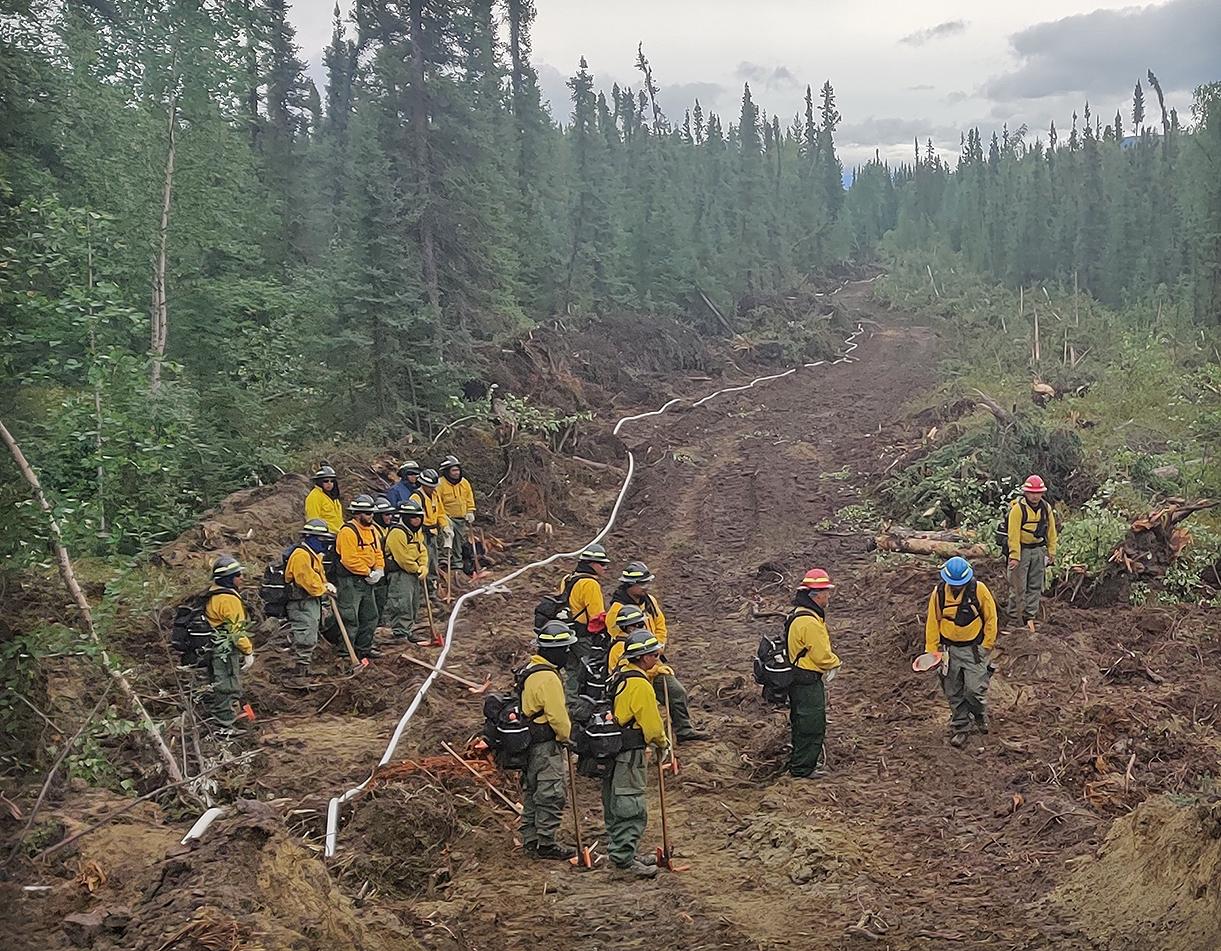 Franco crew members install pumps and hoses on the Mount Hayes Fire