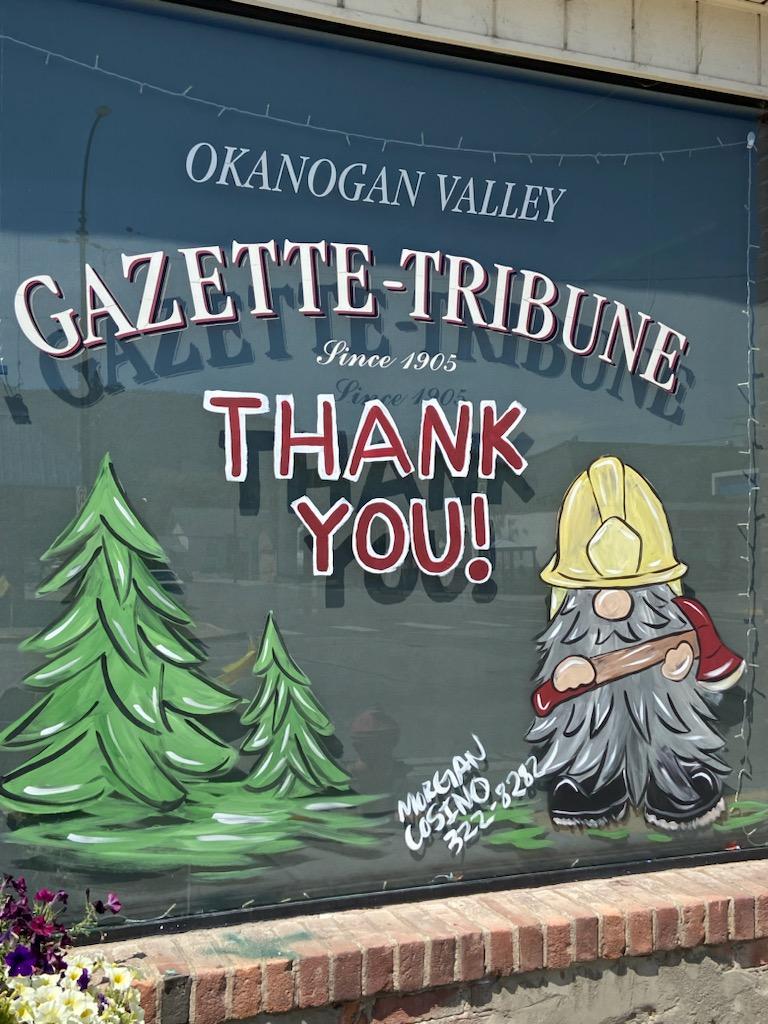 Thank you firefighters painted on the window of Okanogan Valley Gazette-Tribune