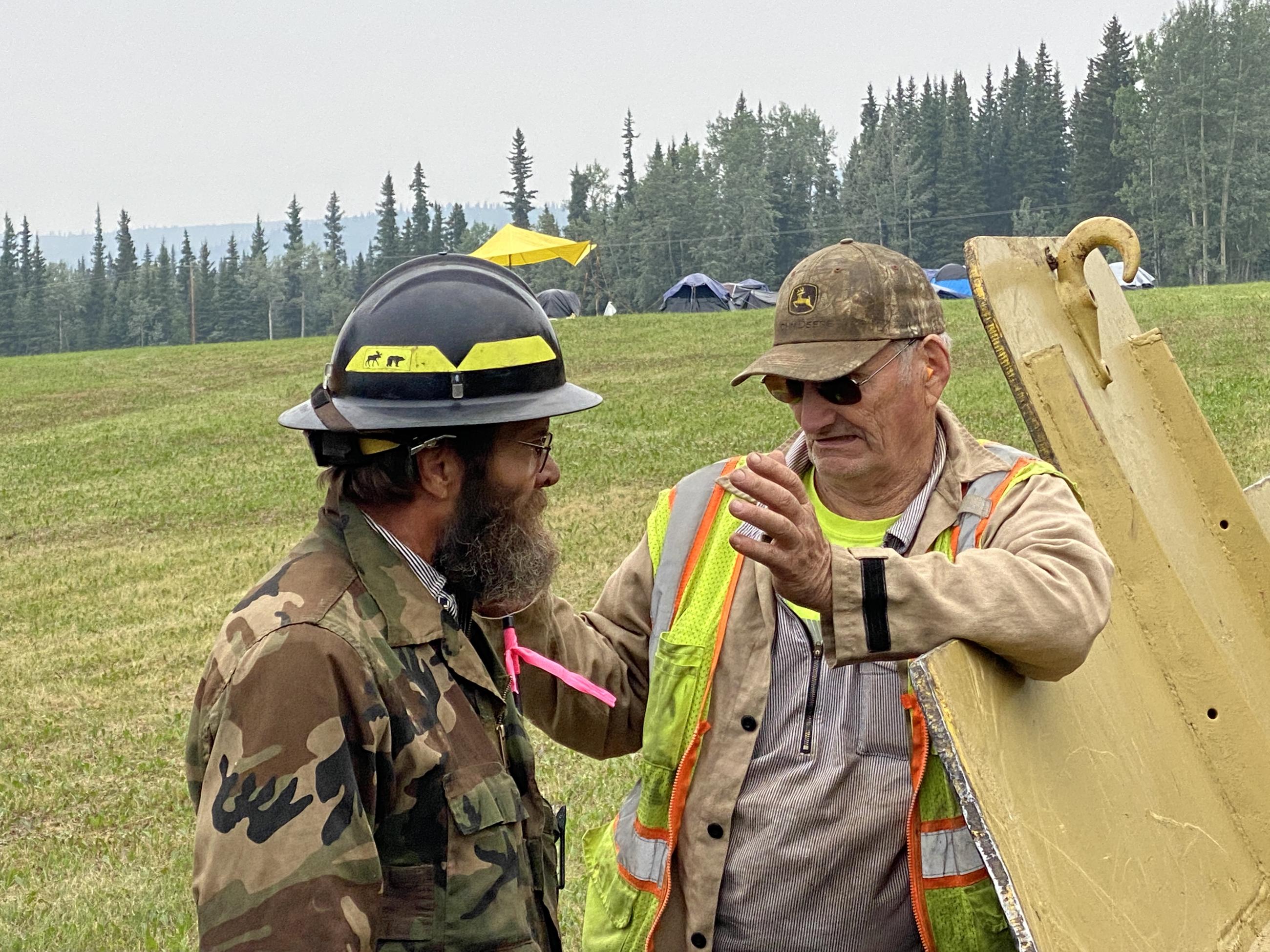 Pumper Cat Dozer operators strategize before a strategic firing operation on the Pogo Mine Road Fire #191.