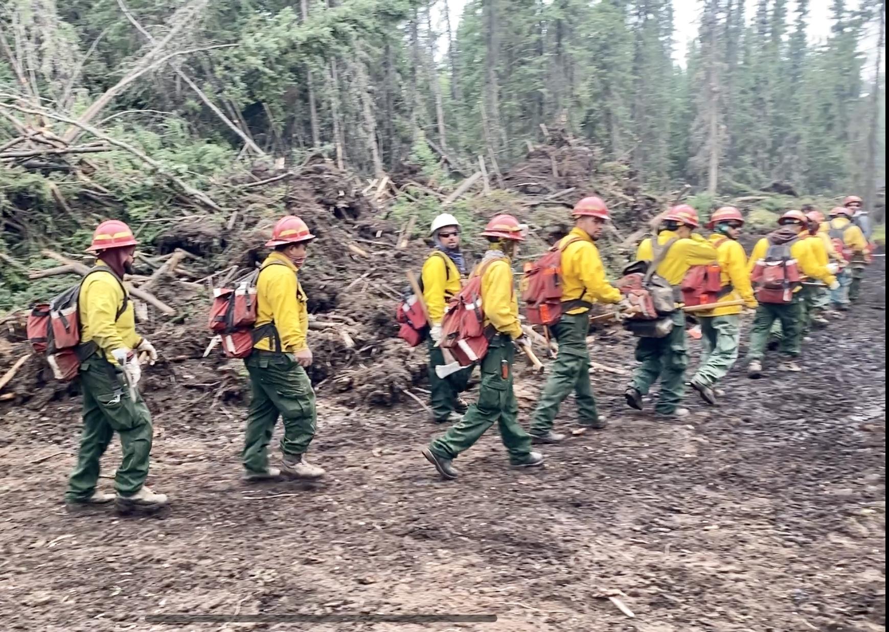 Fire crews work to secure fireline around private structures within the Pogo Mine Road Gate. Photo: Kale Casey / AK DOF