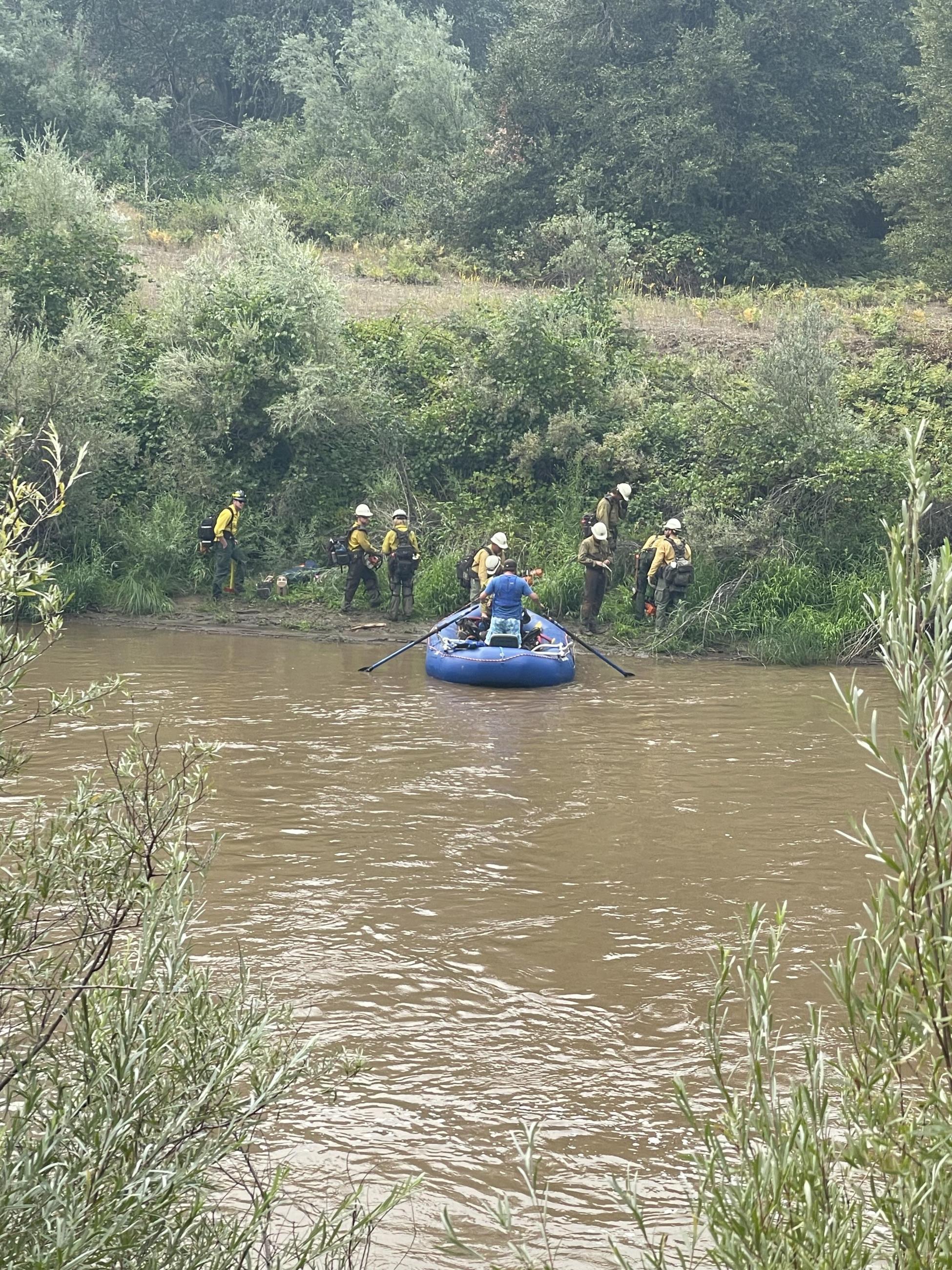 Image of Santa Fe Hotshots crossing the Klamath River on the Head River. Photo USDA Forest Service courtesy Rachel Smith