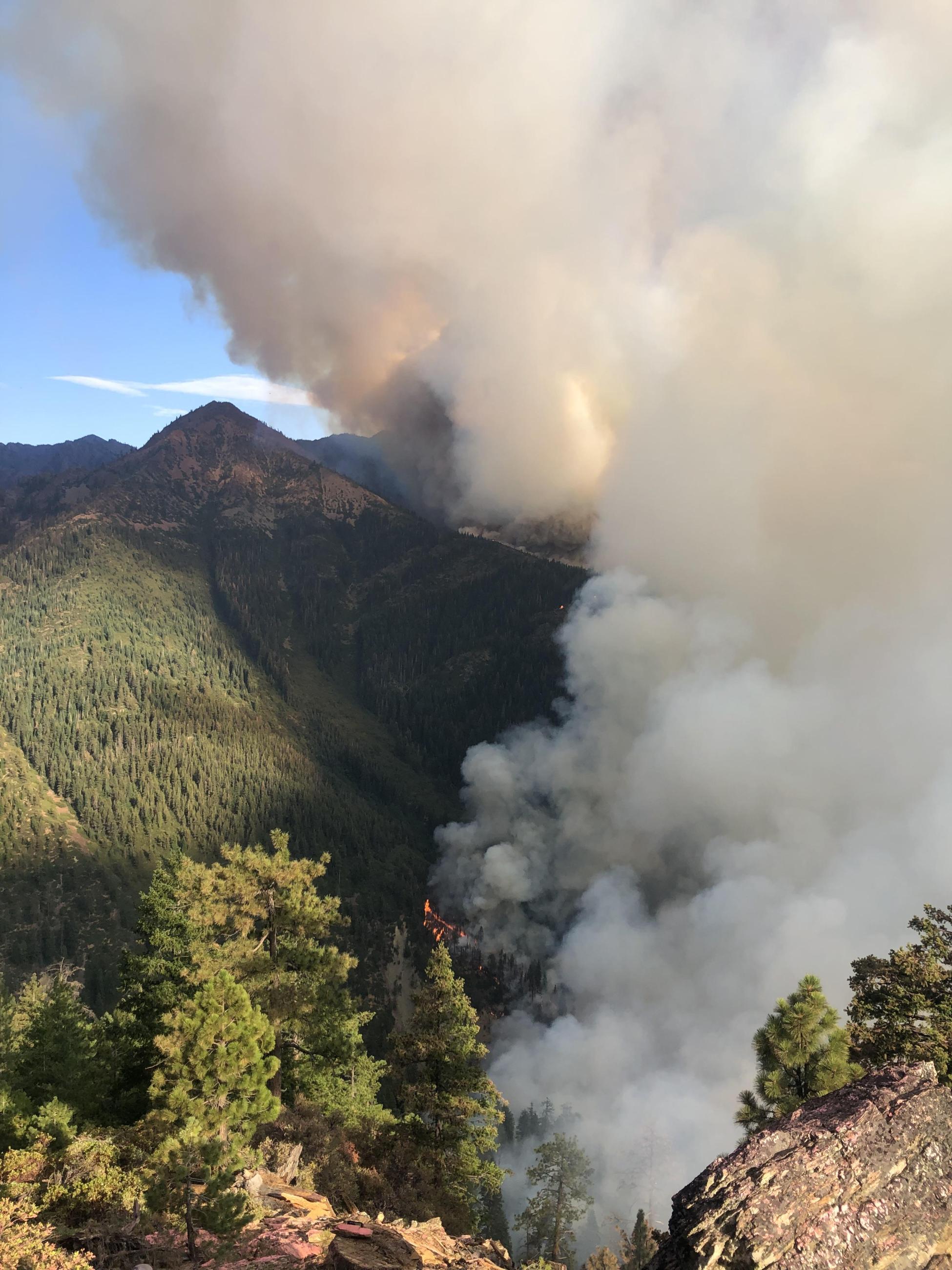 Fire burning in steep canyon
