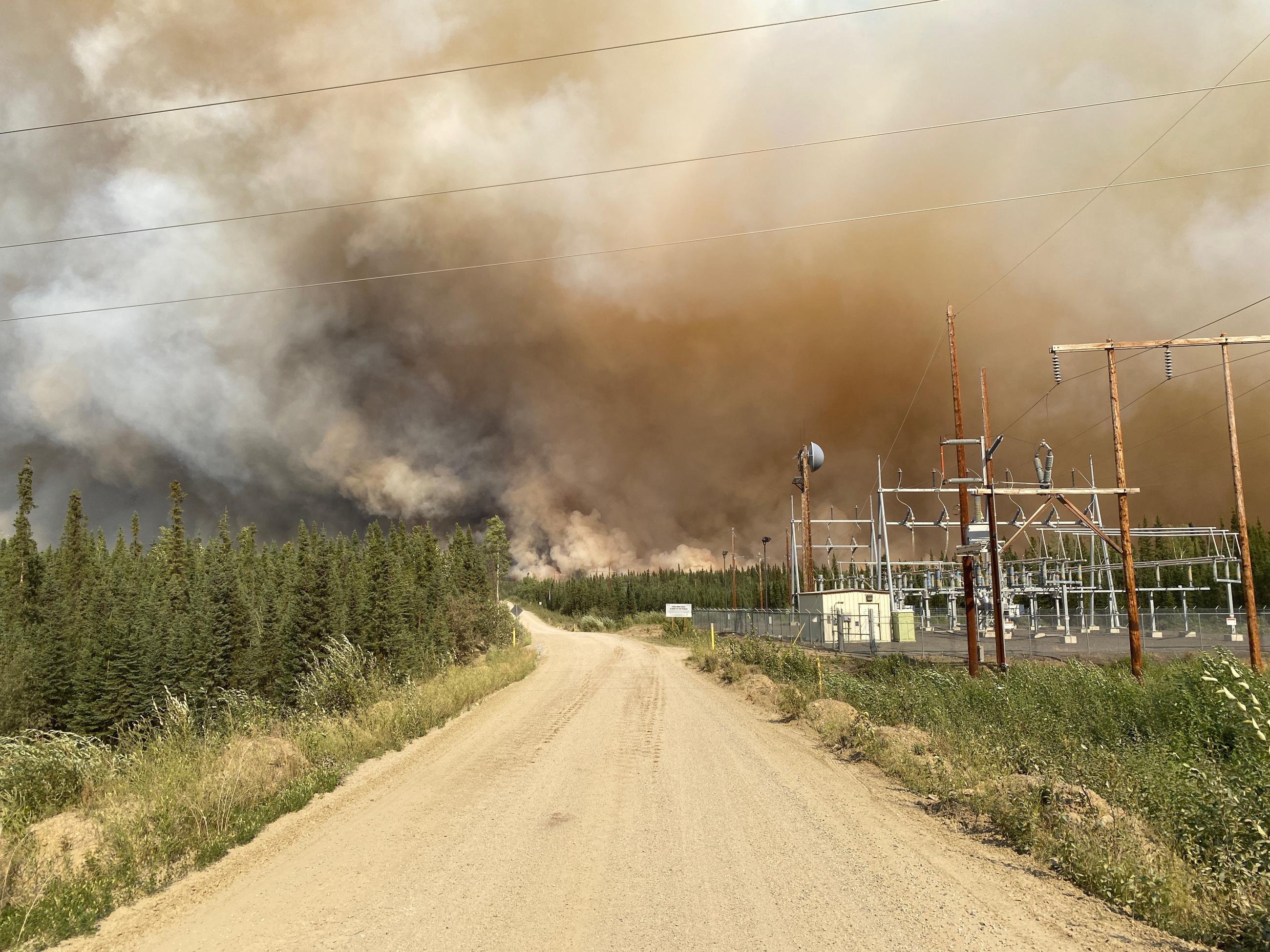 Fire crosses Pogo Mine Road on August 6, 2023