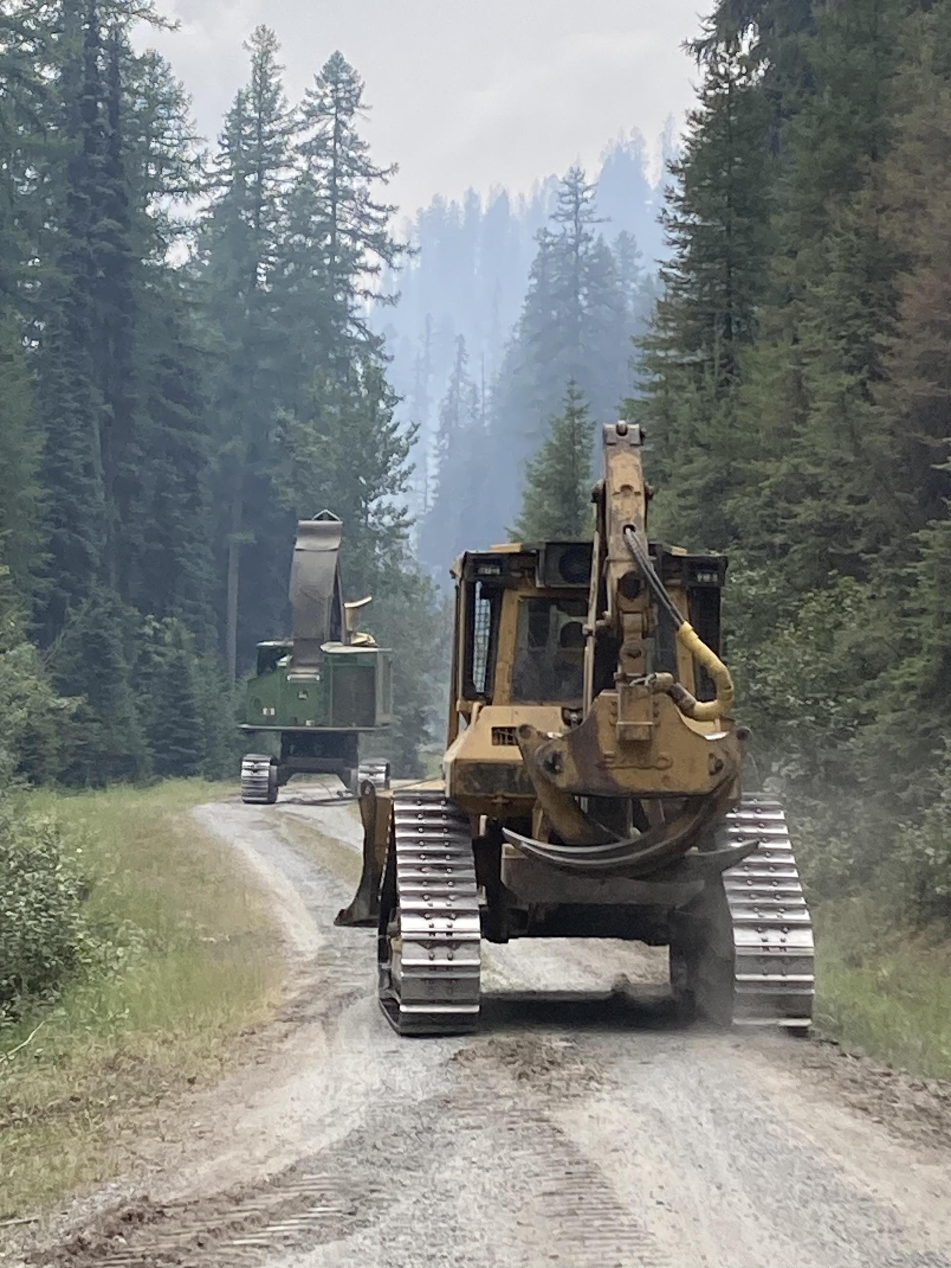 East Fork Fire Heavy Equipment moving down a two track road