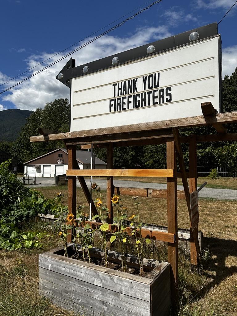 A sign posted by a local business that reads "Thank You Firefighters" to showcase support for firefighting personnel.