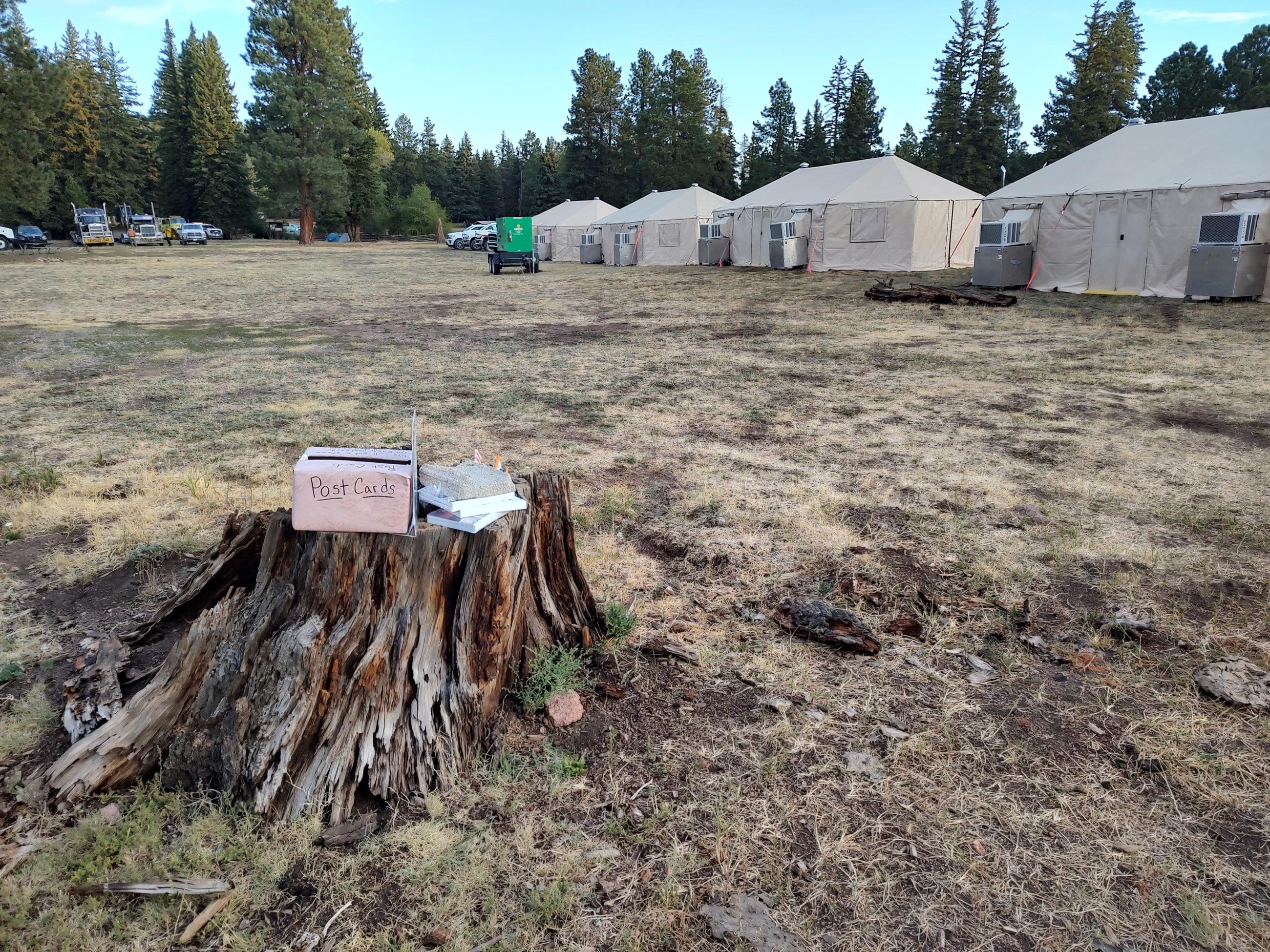 Image is of a make-shift mailbox where fire personnel can put post cards or letters to be mailed home. 