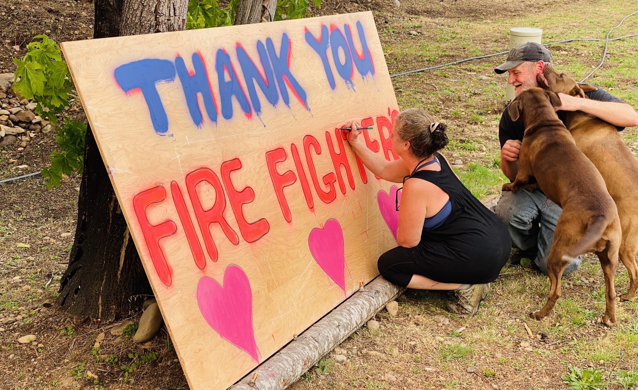 Locals making thank you firefighter sign 8/20/2023