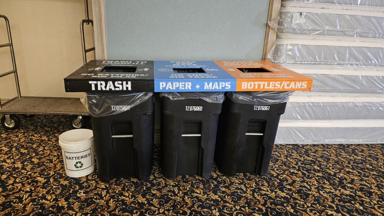 Image shows three recycling containers with labels.