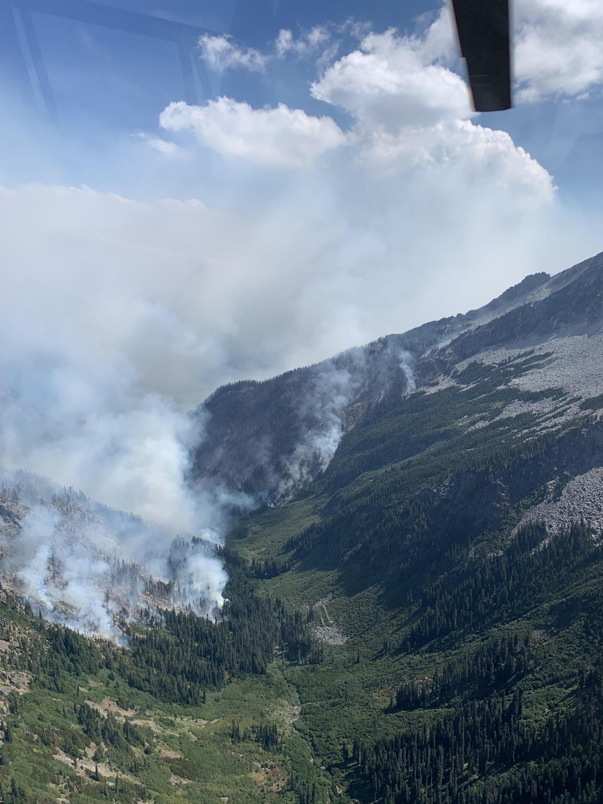 Smoke rising from the Airplane Lake Fire on August 22, 2023 as viewed from a helicopter flying nearby.
