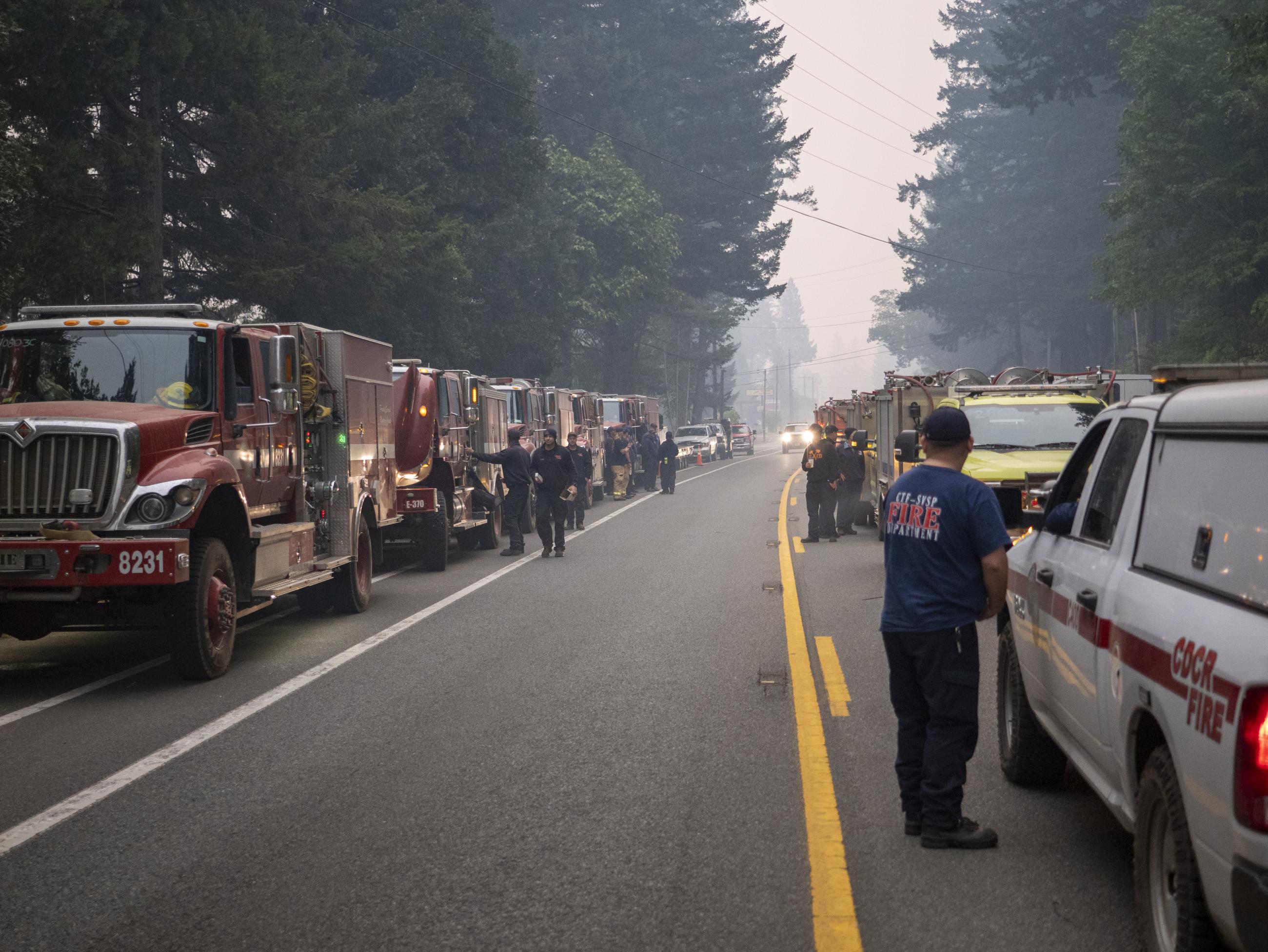 Fire engines line the roadway outside of Ward Field fire camp in Gasquet. August 24, 2023