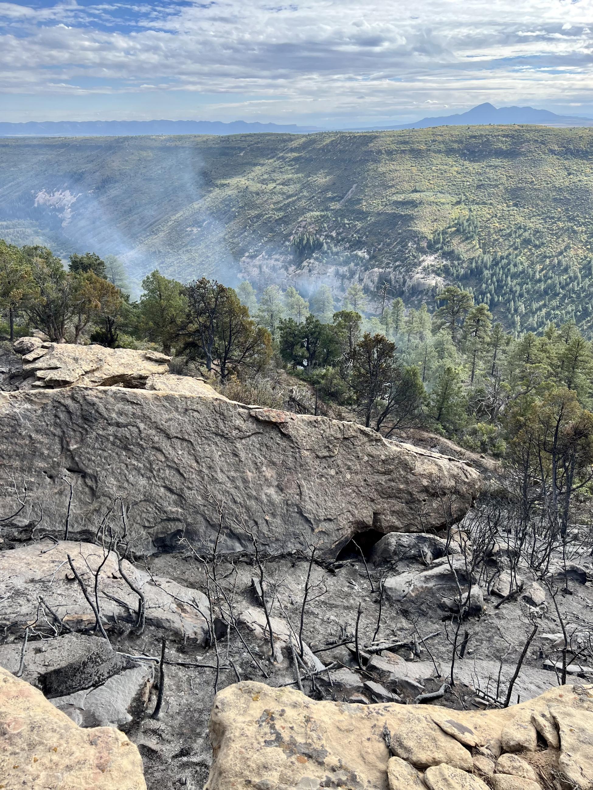 Smoke rising from rocks