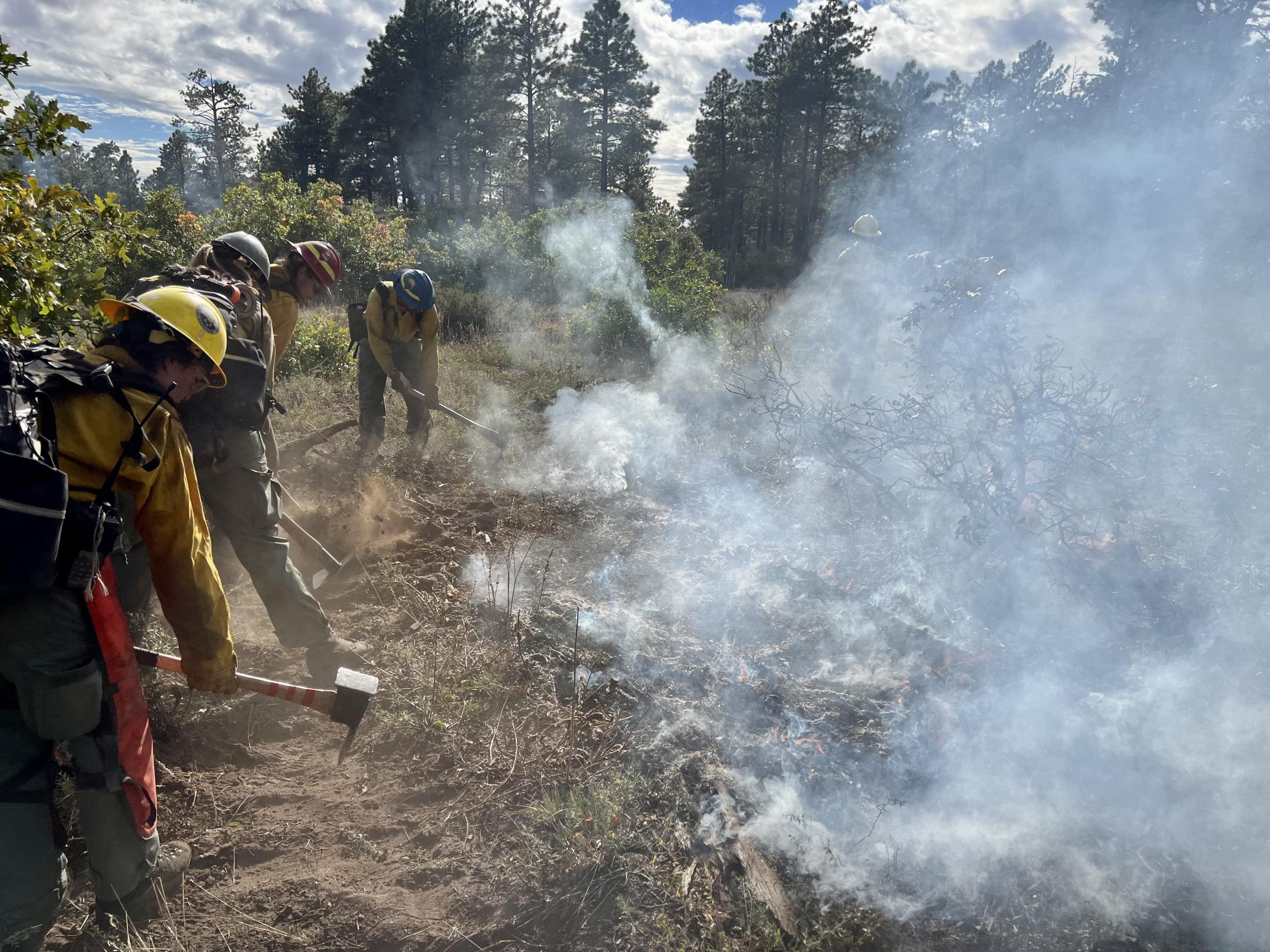 Firefighters securing line