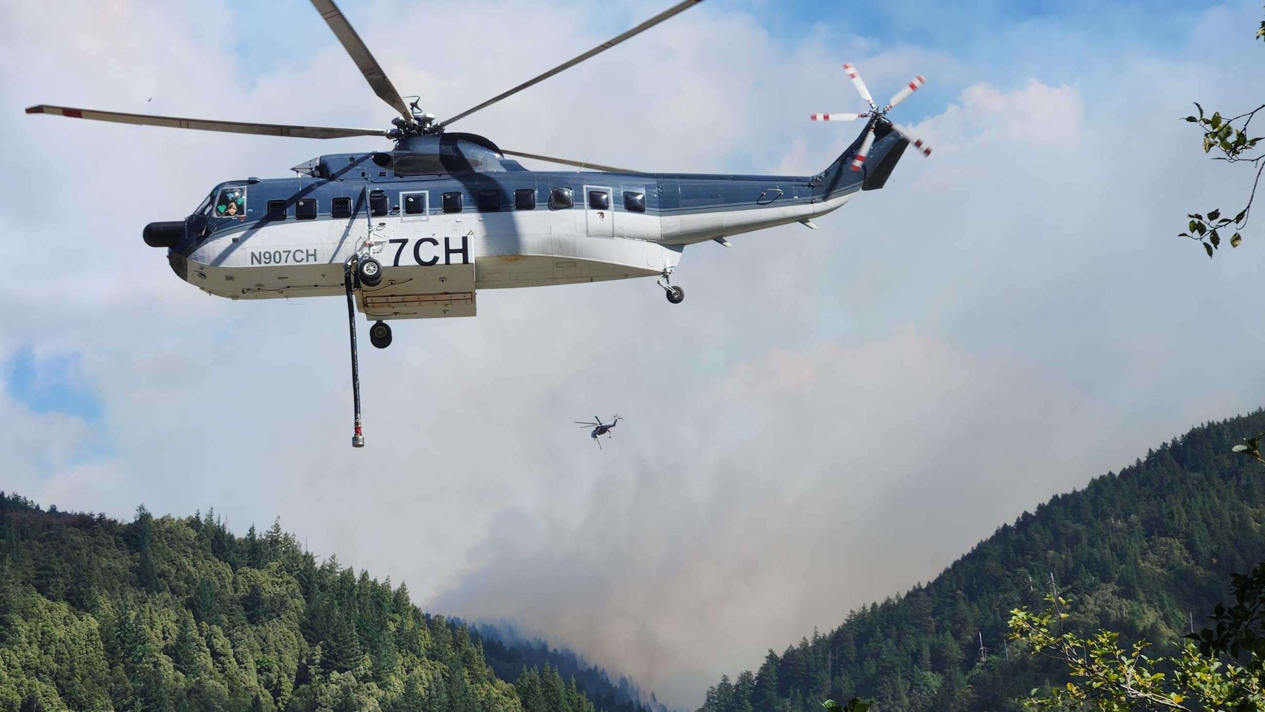 Two Helicopters Working the Anvil Fire with smoke in the background Sept. 20