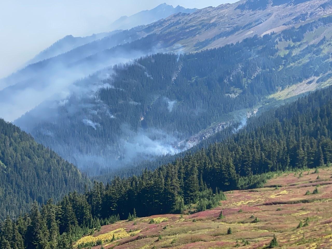 Wispy white smoke from the Airplane Lake Fire is visible from the Pacific Crest Trail near White Pass in the Glacier Peak Wilderness Area.