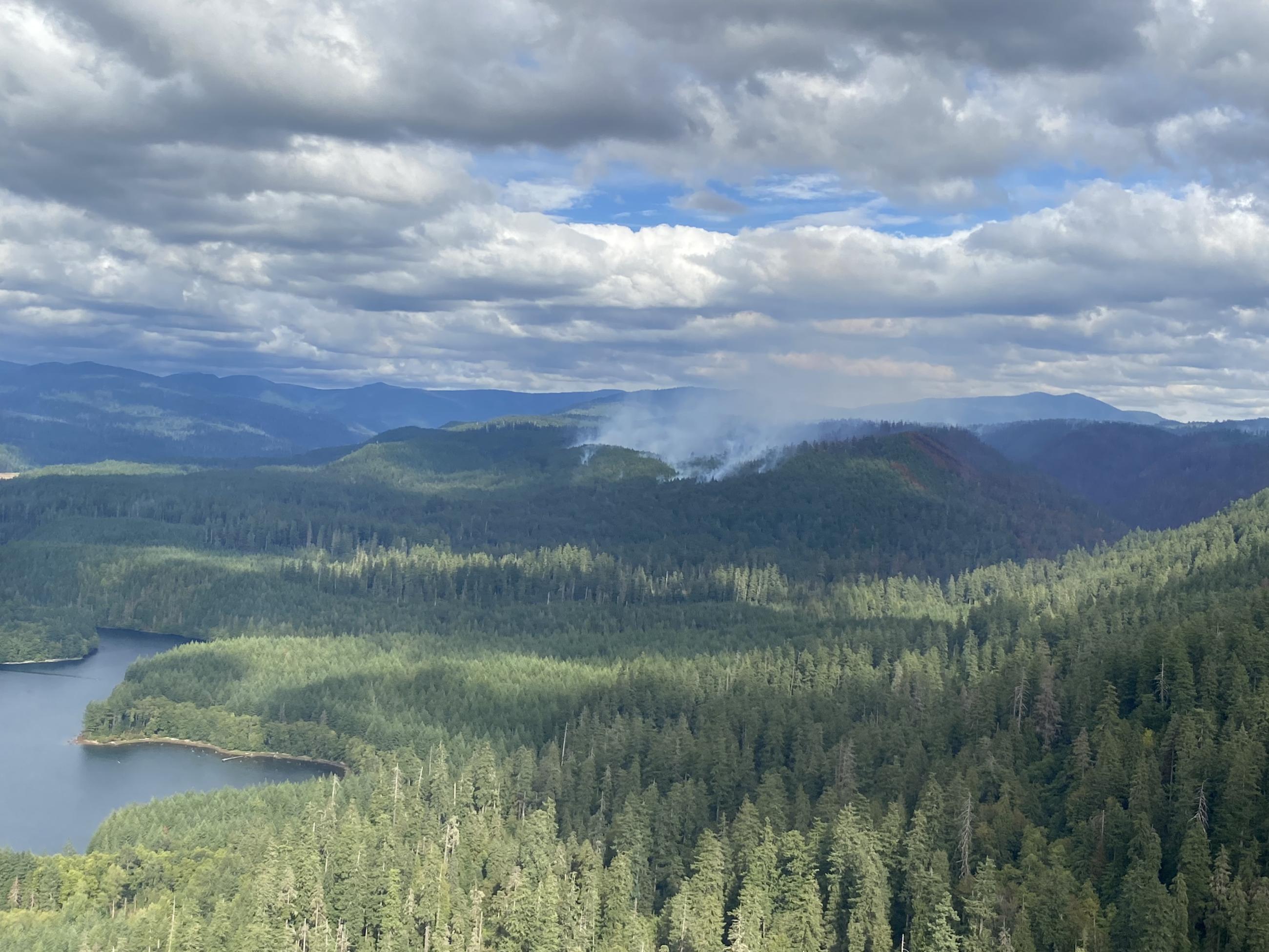 an aerial view of Smoke seen on the ridgeline with the lower reservior in the foreground