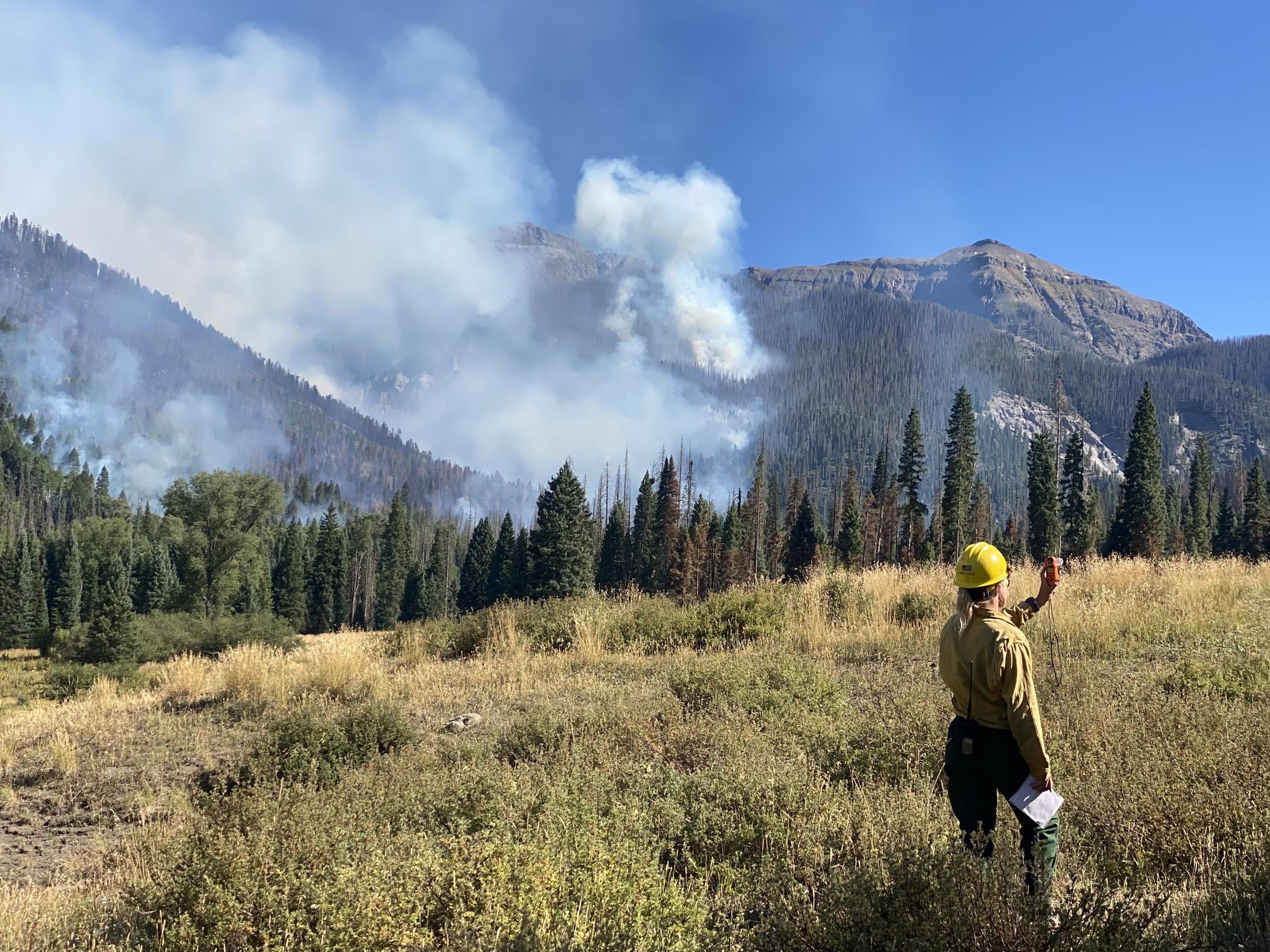 Firefighter takes weather readings with her Kestrel on the Quartz Ridge Fire.