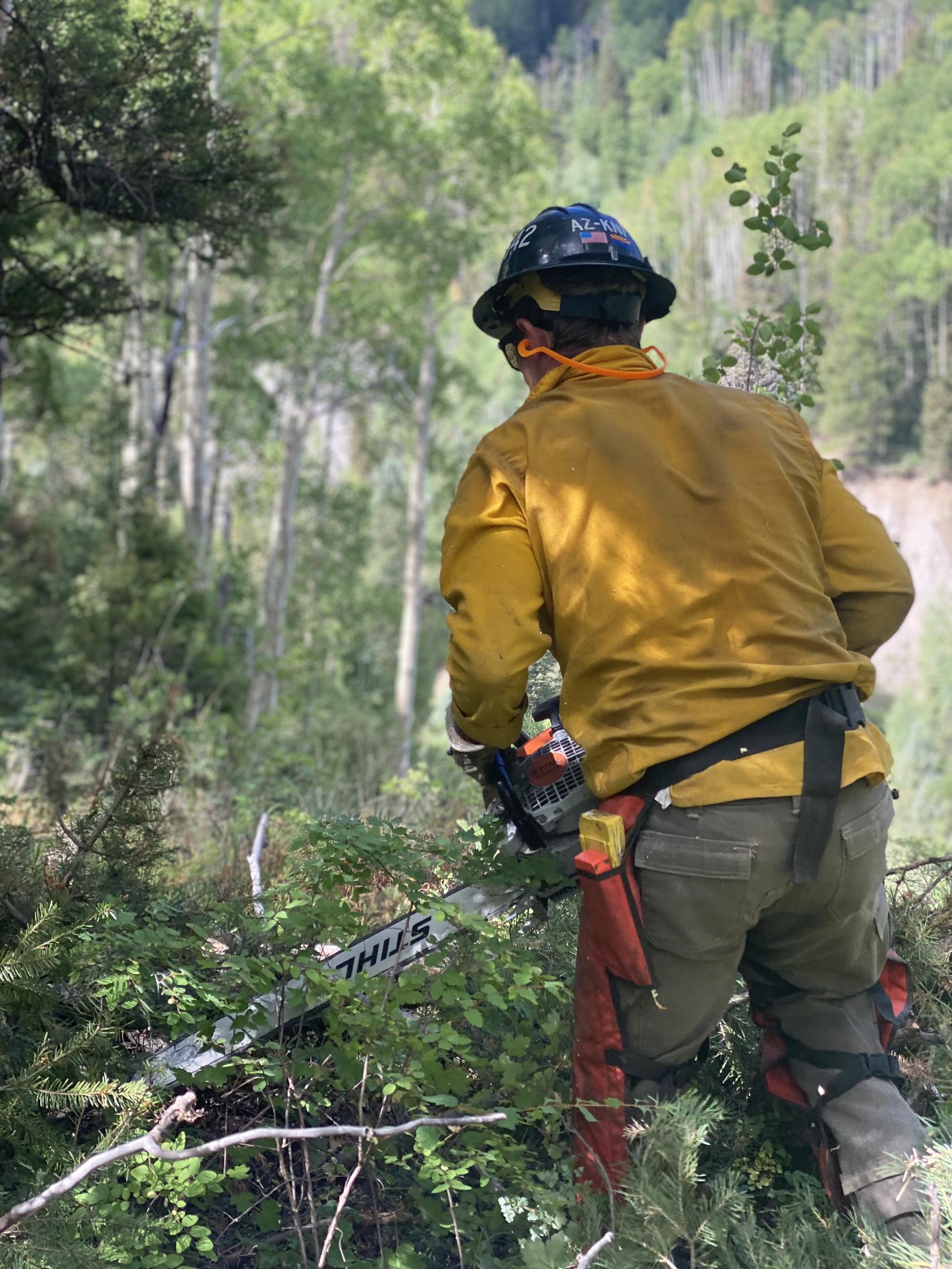 Firefighter using a chainsaw