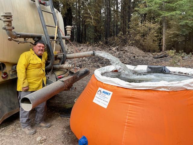 Operator fills a pumpkin to provide onsite water