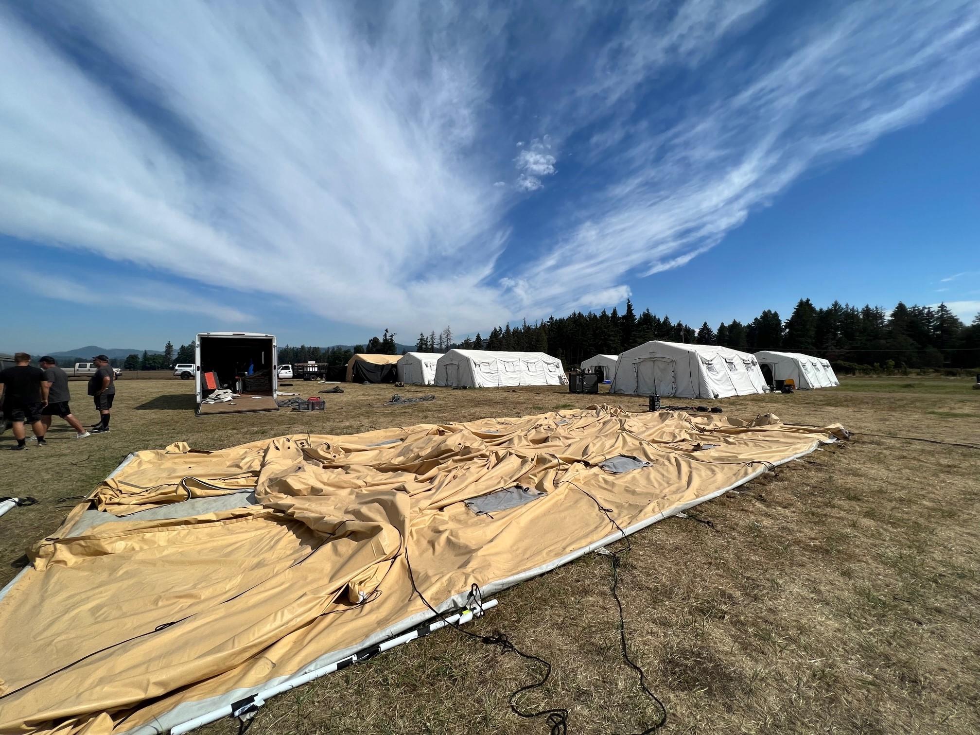 This is a photo of tents and yurts being assembled